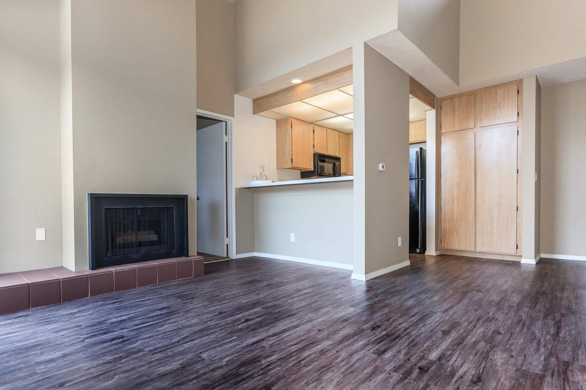 a large empty room with a wood floor