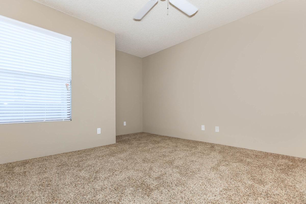 a bedroom with a large window
