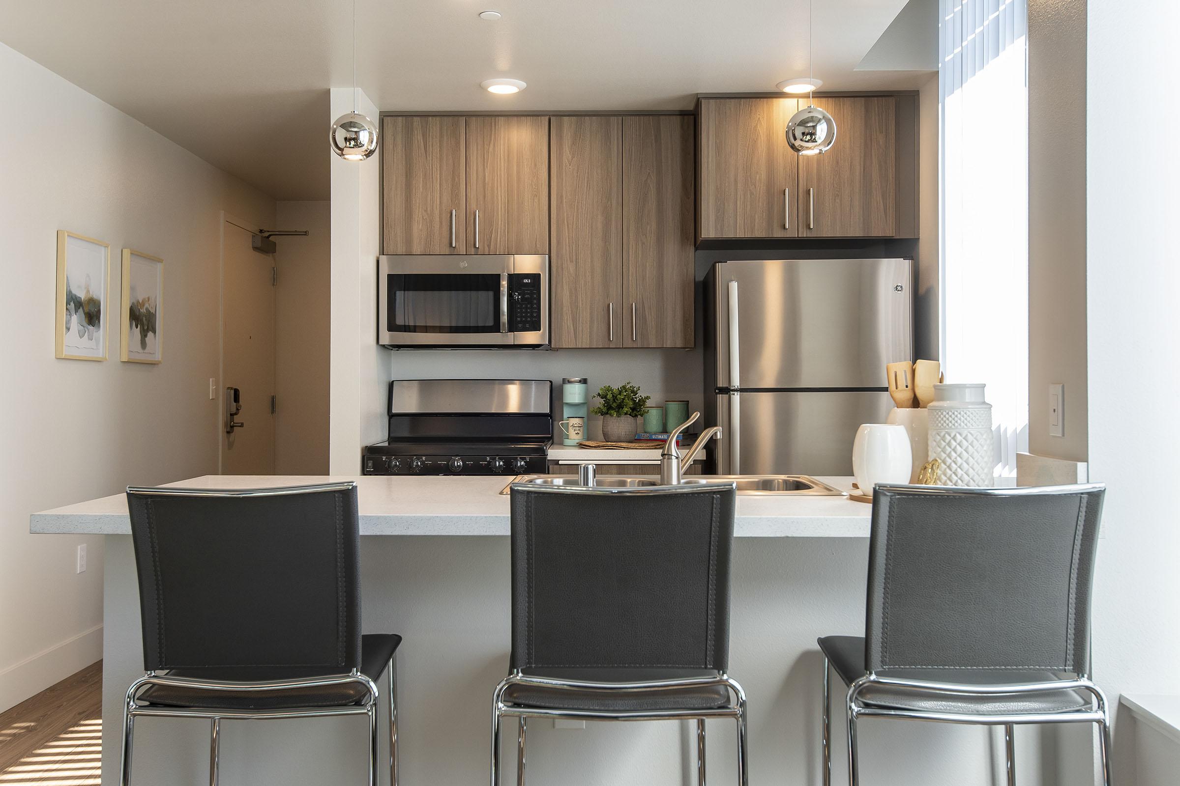 a modern kitchen with stainless steel appliances