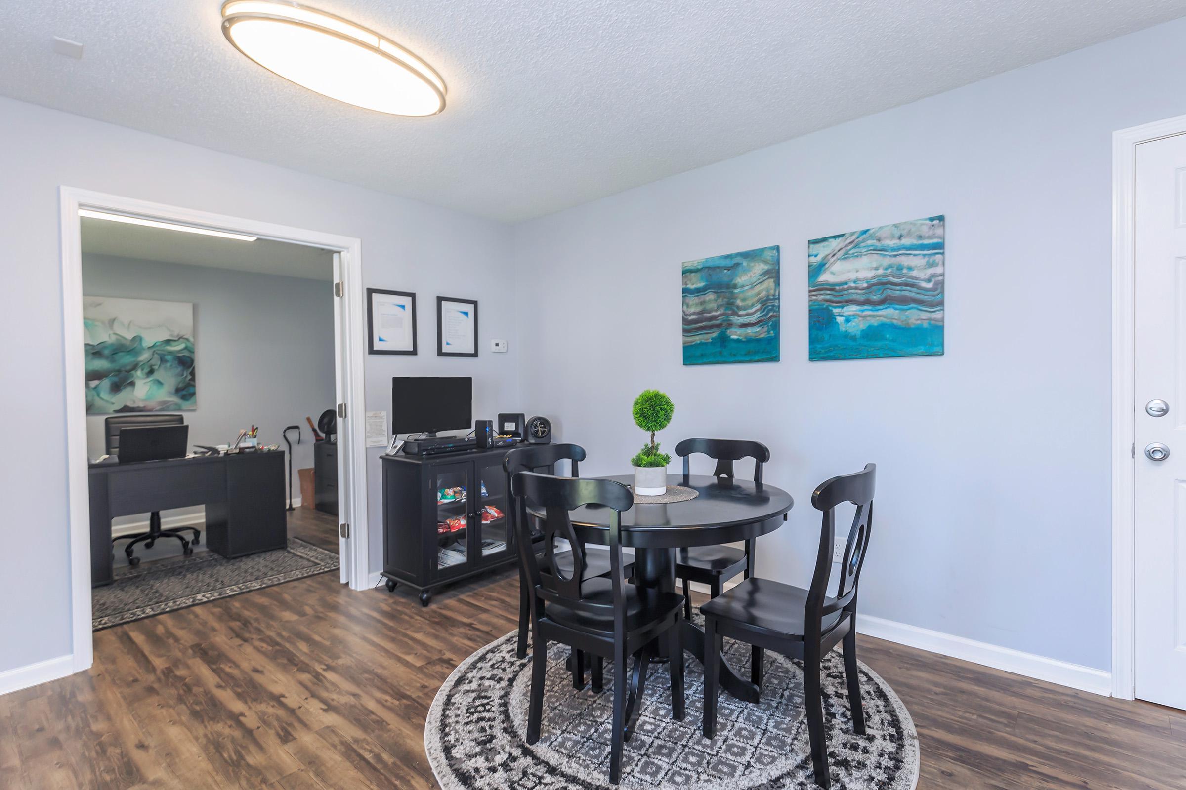 a living room filled with furniture and a flat screen tv