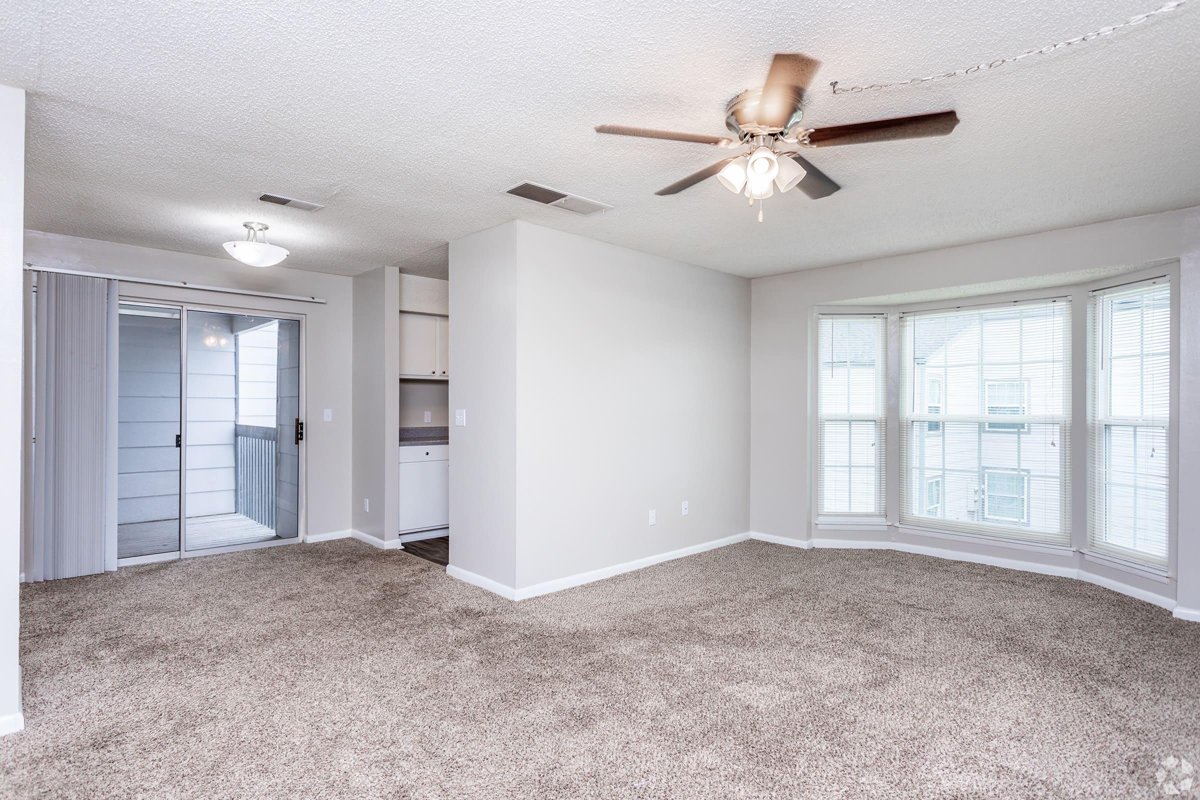 a room filled with furniture and a large window