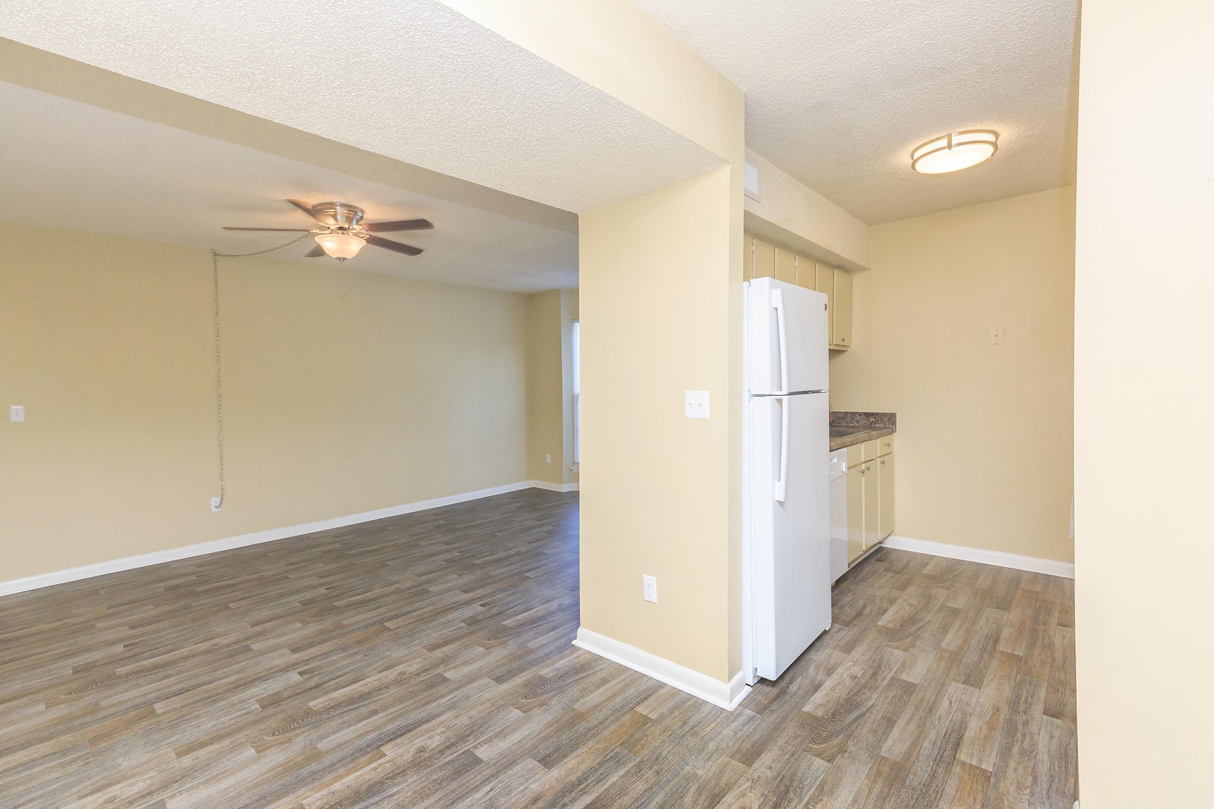 a large empty room with a wooden floor