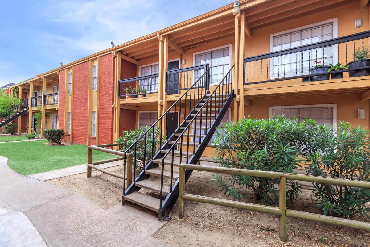 a wooden bench in front of a building