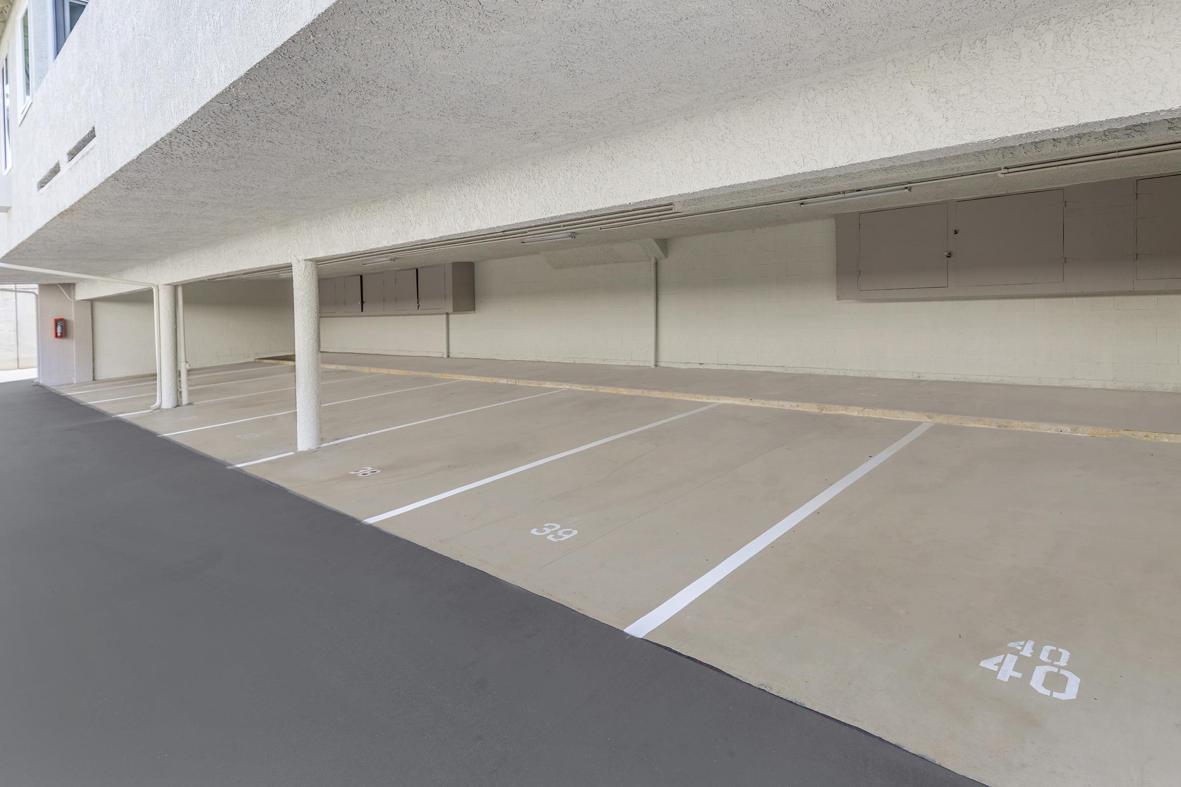 an empty parking lot in front of a building