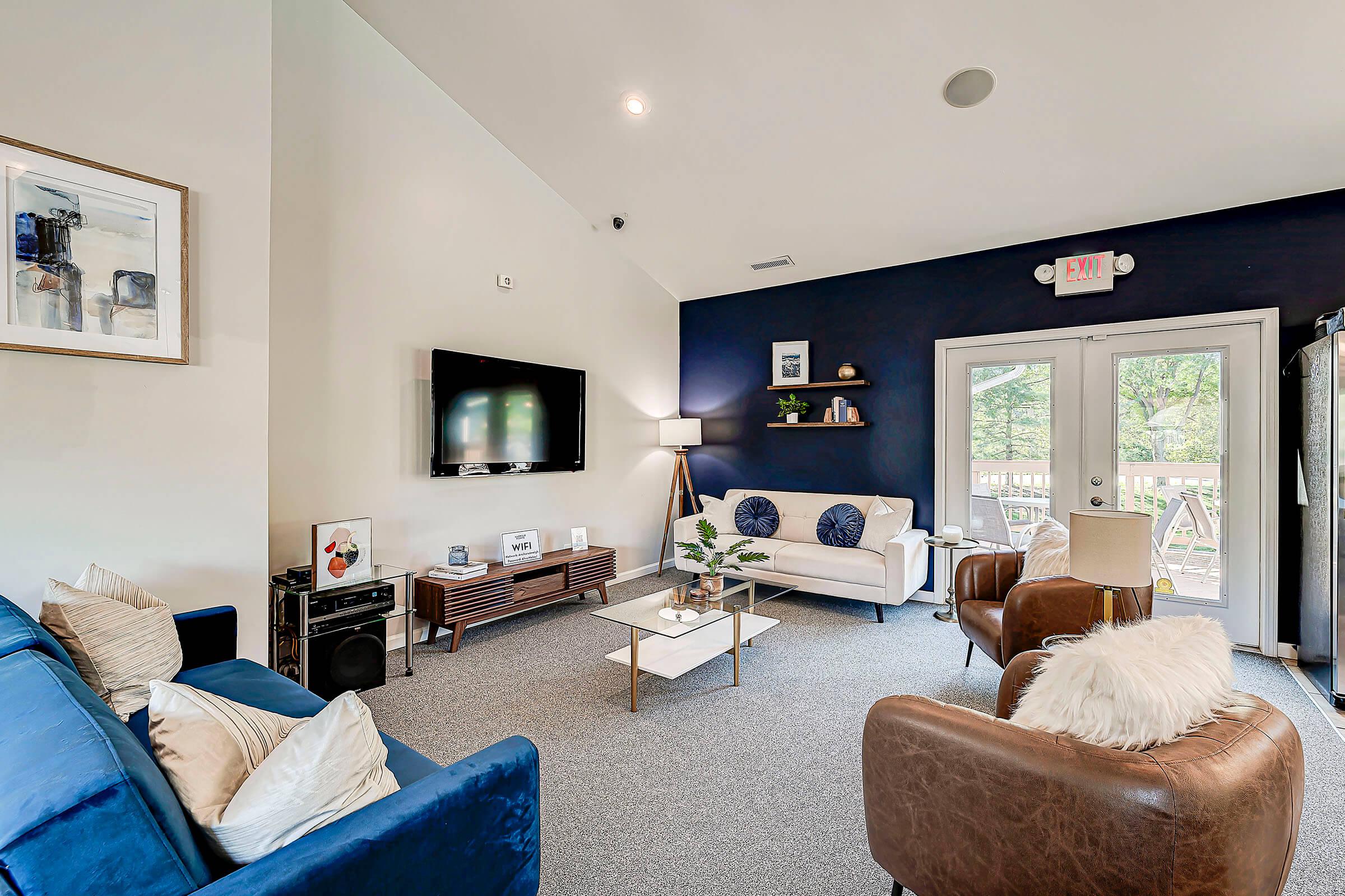 a living room filled with furniture and a fire place