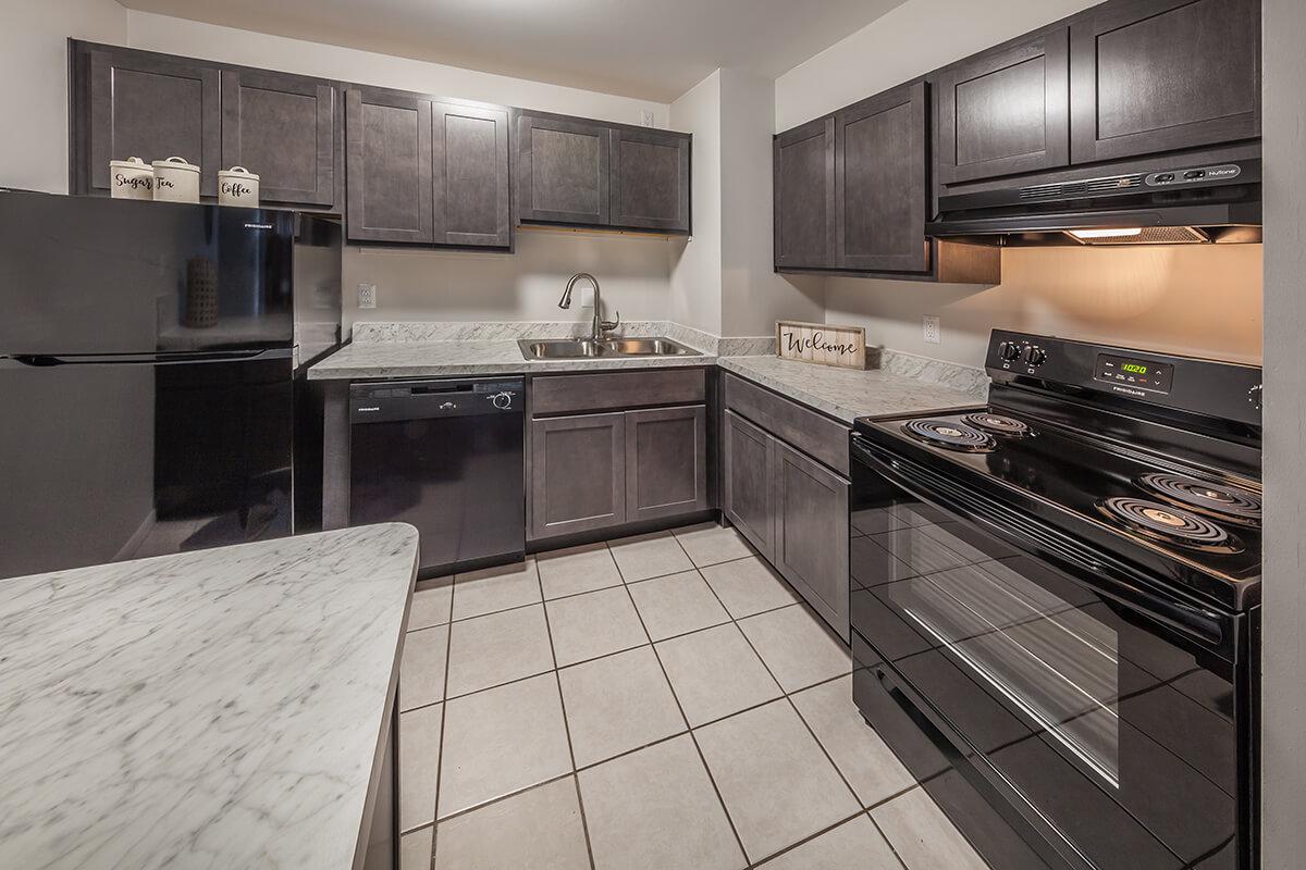 a large kitchen with stainless steel appliances