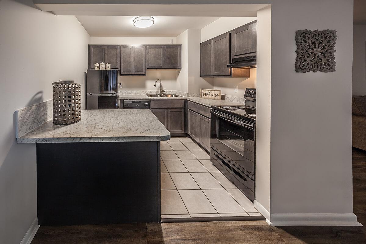 a kitchen with a table in a room