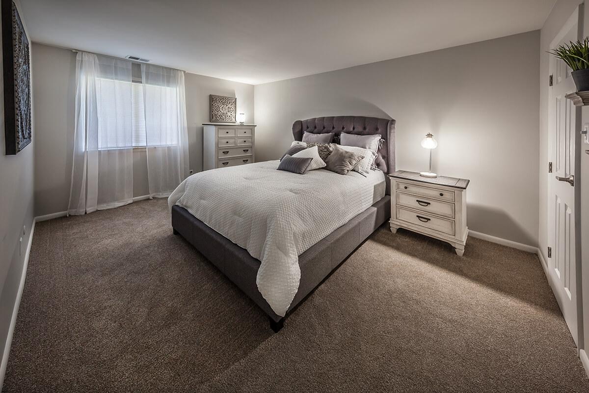 a bedroom with a large bed in a hotel room