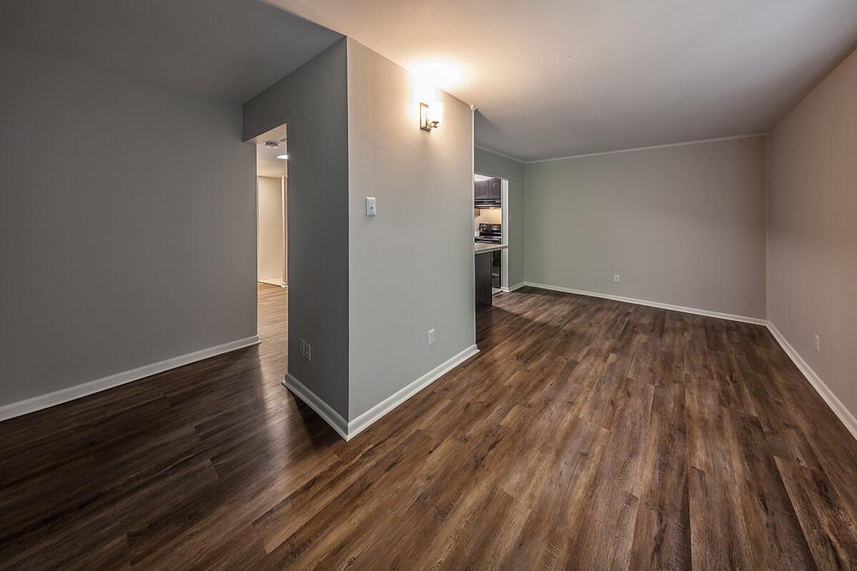 a large empty room with a wood floor