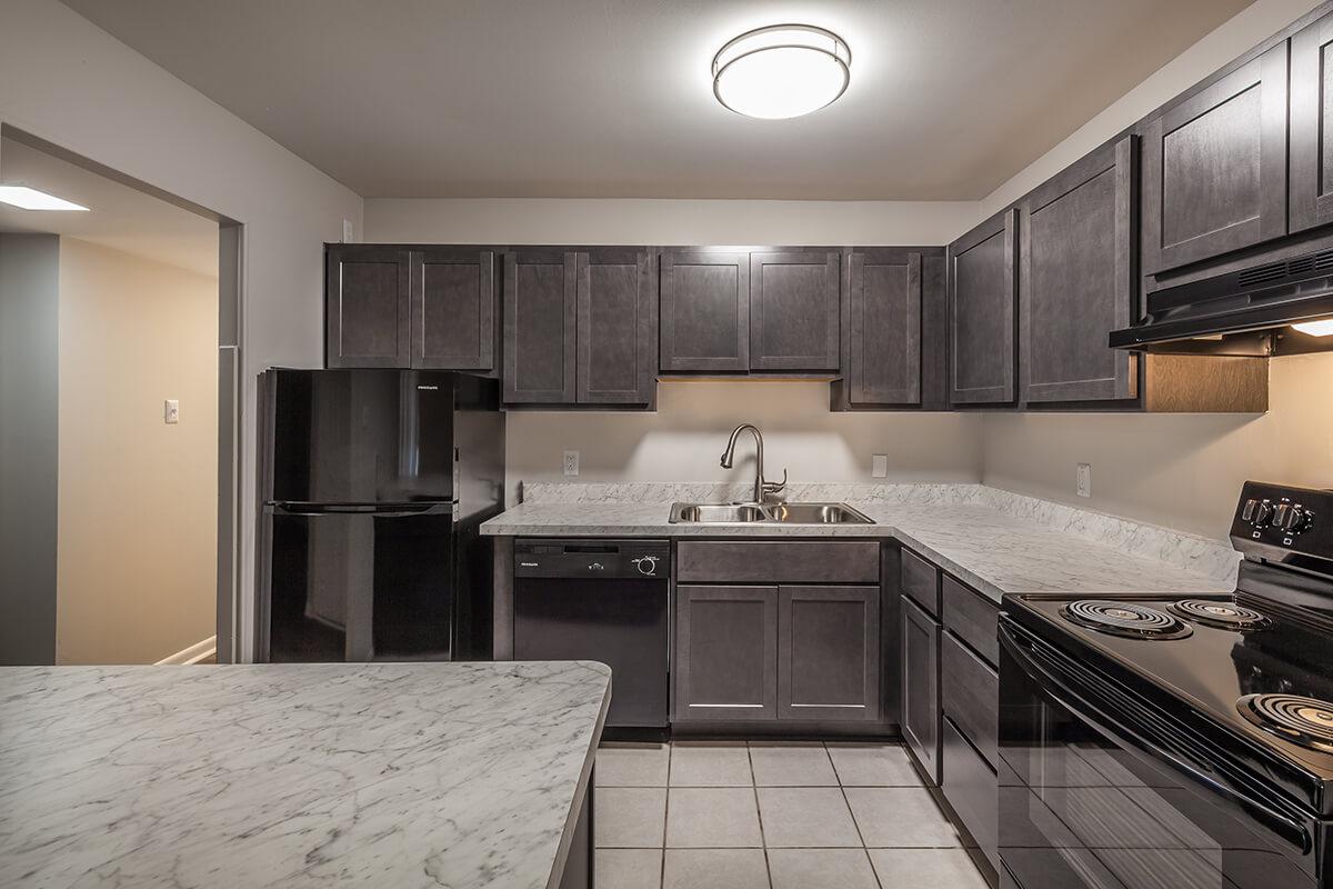 a kitchen with a large bed in a room