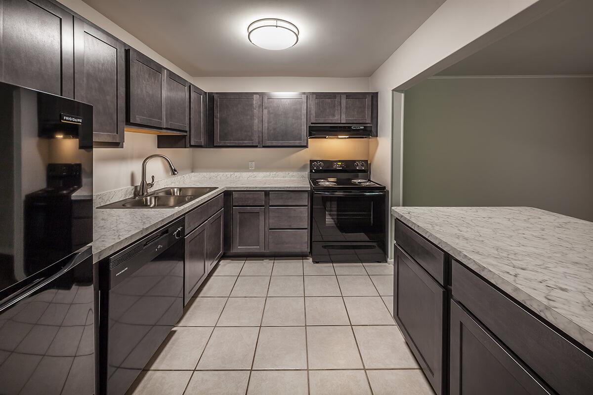 a modern kitchen with stainless steel appliances