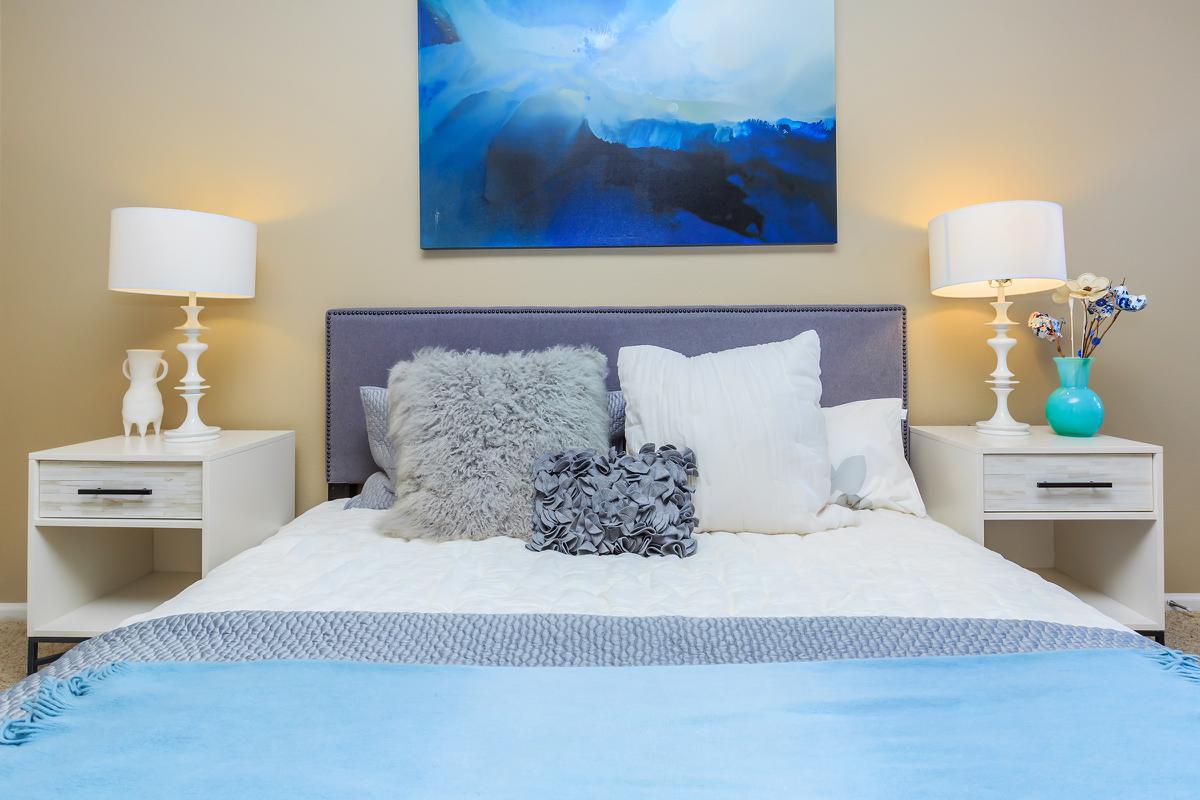 a large white bed in a room