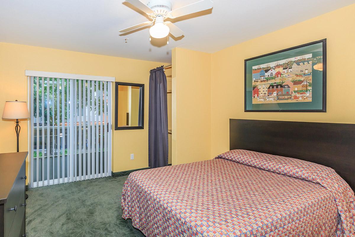a bedroom with a bed in a hotel room
