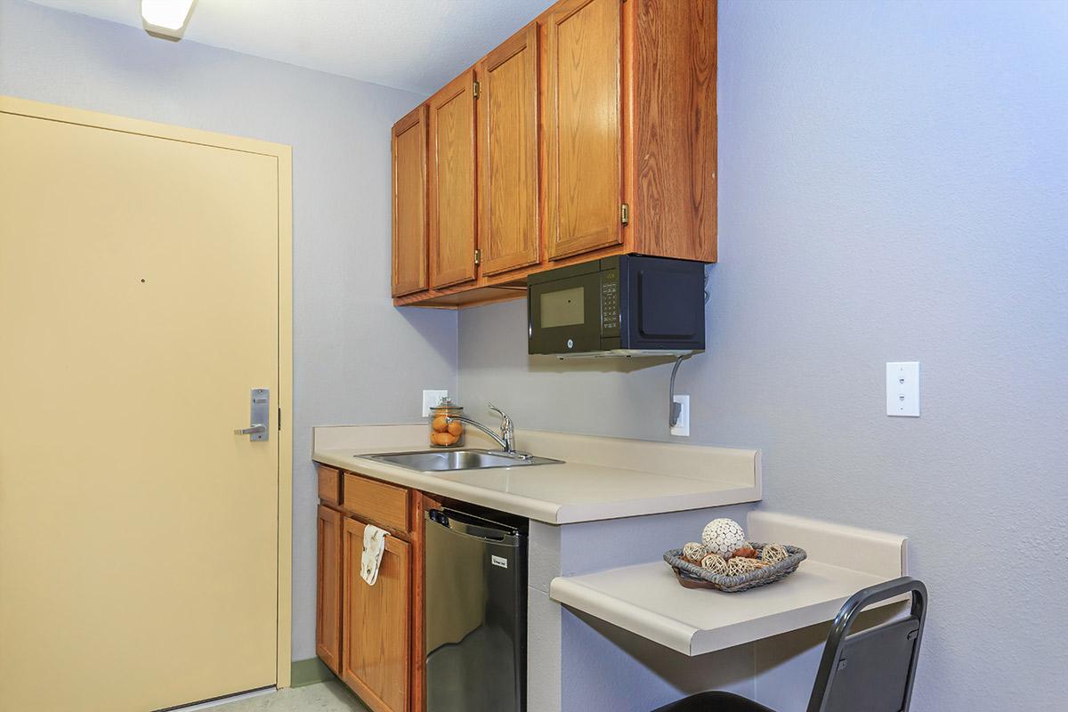 a kitchen with a sink and a refrigerator