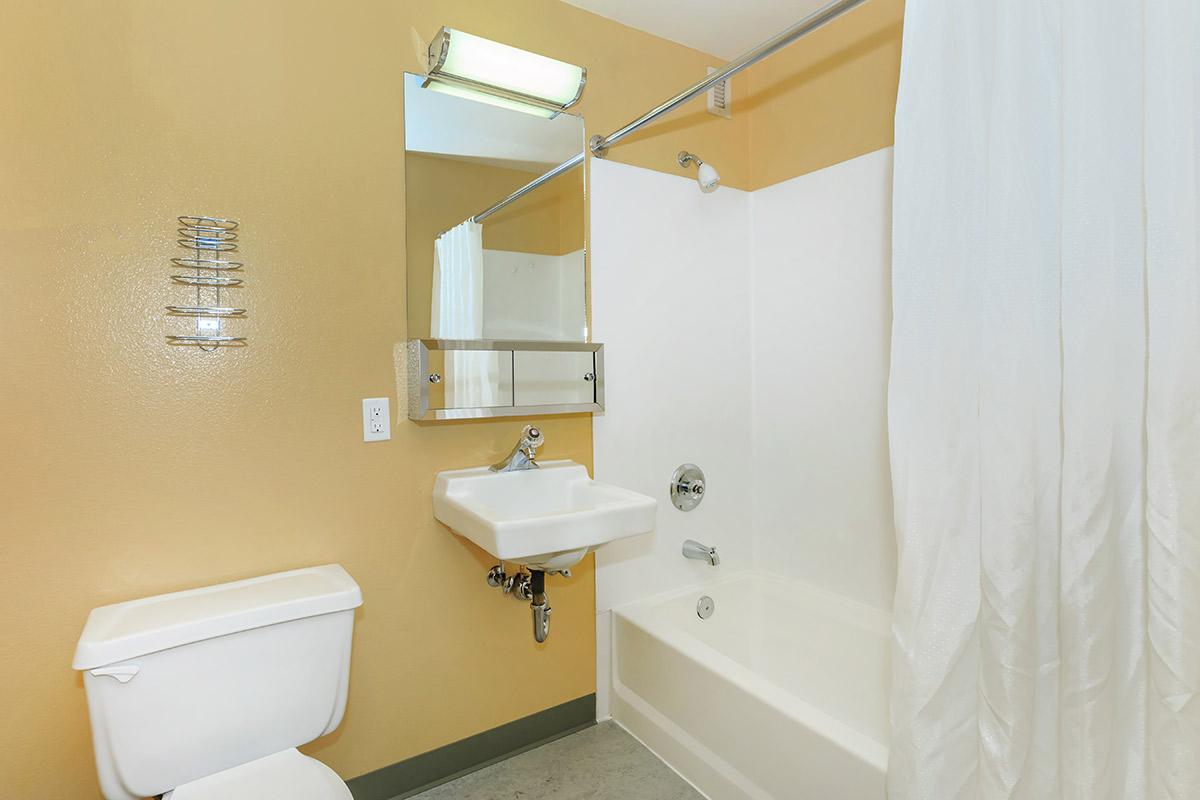 a white sink and a mirror