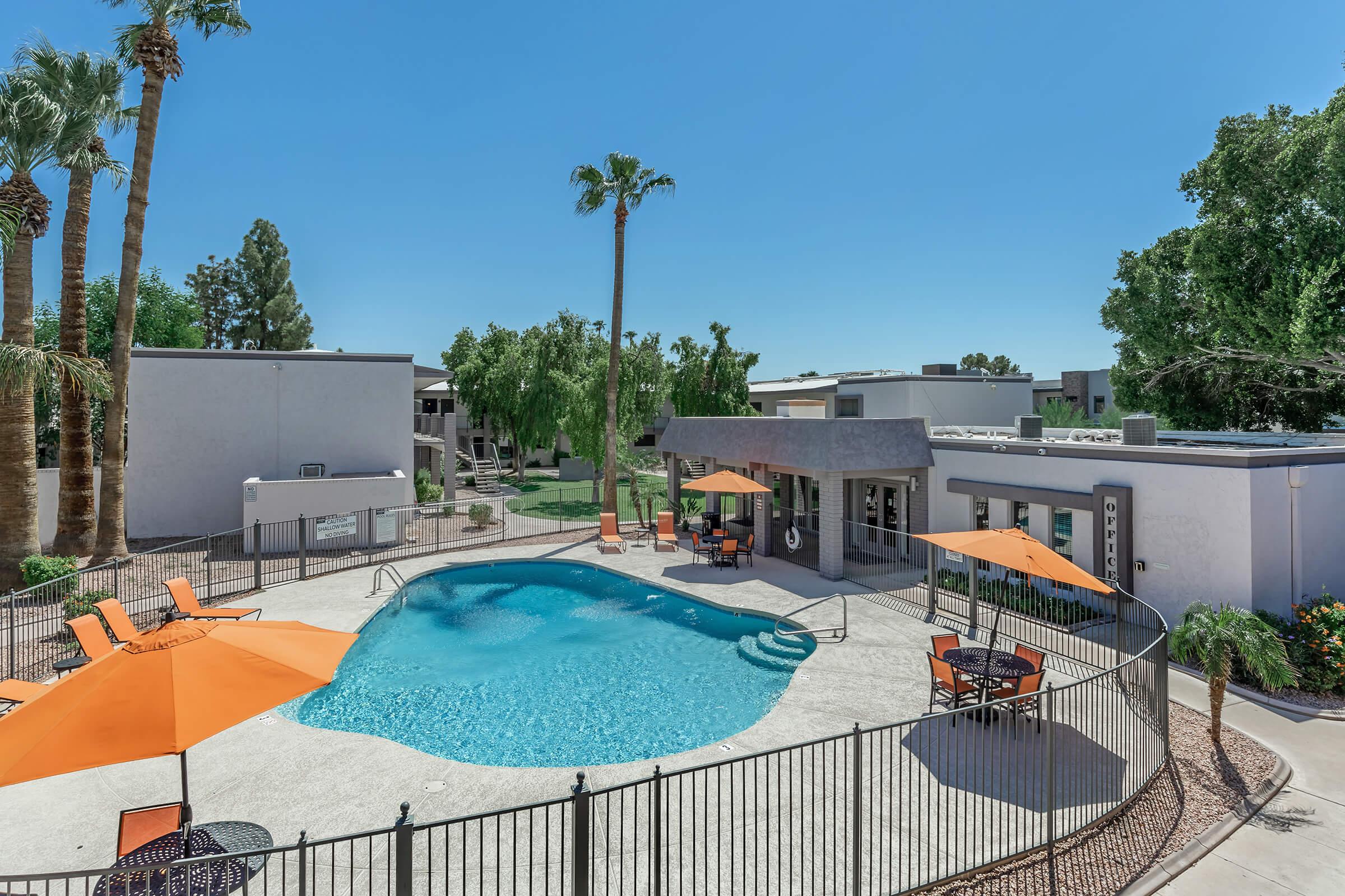 a pool next to a fence