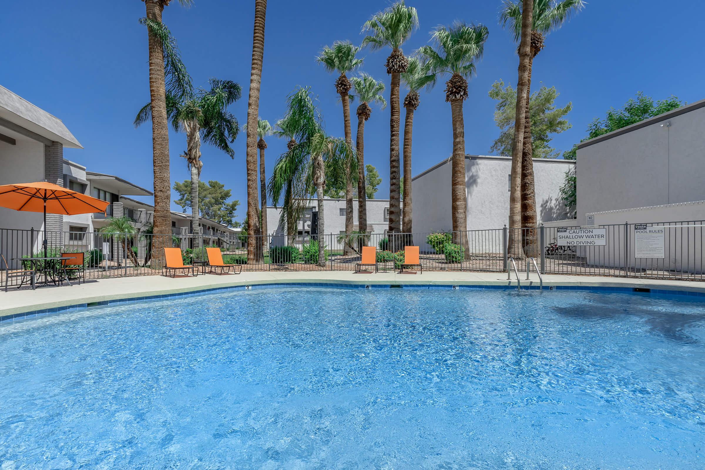 a large pool of water in front of a building