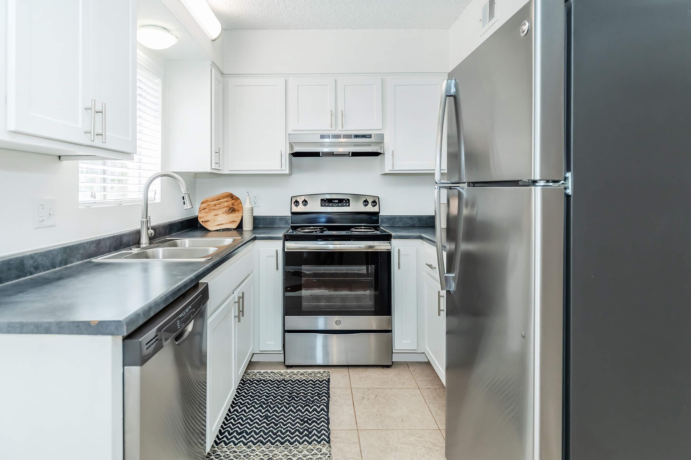 a kitchen with a stove top oven sitting inside of a refrigerator