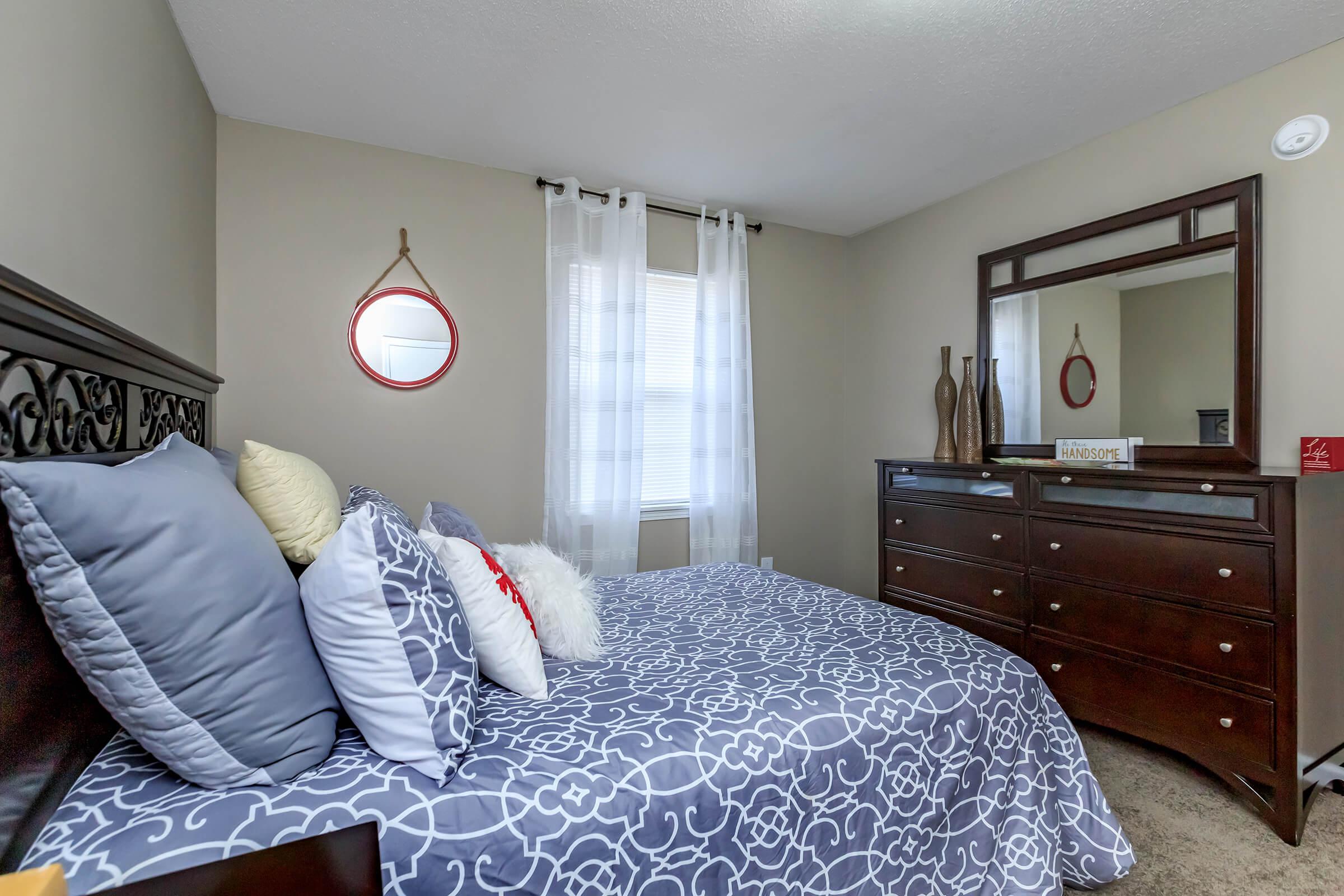a bedroom with a large bed in a room