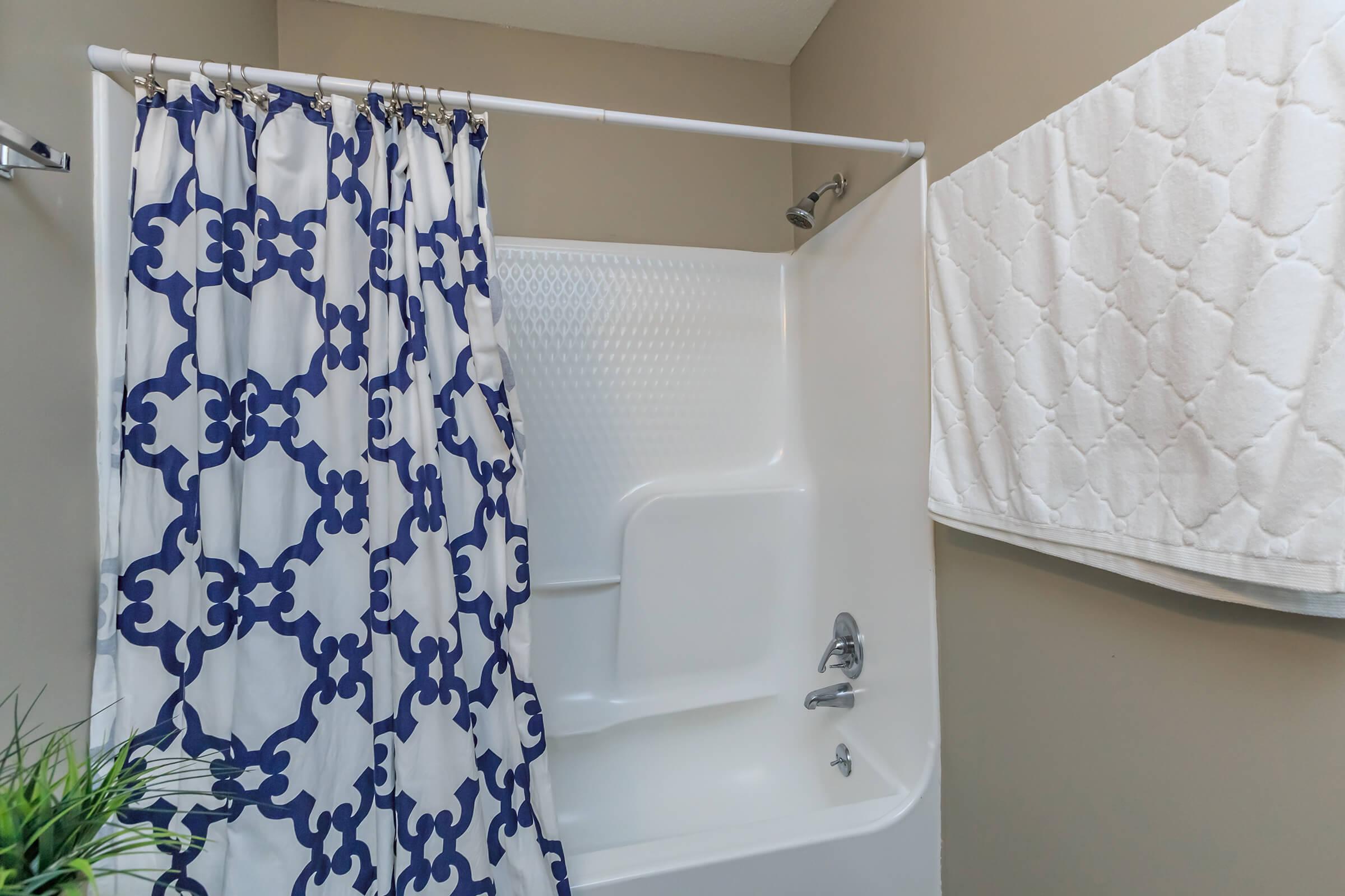 a blue and white shower curtain
