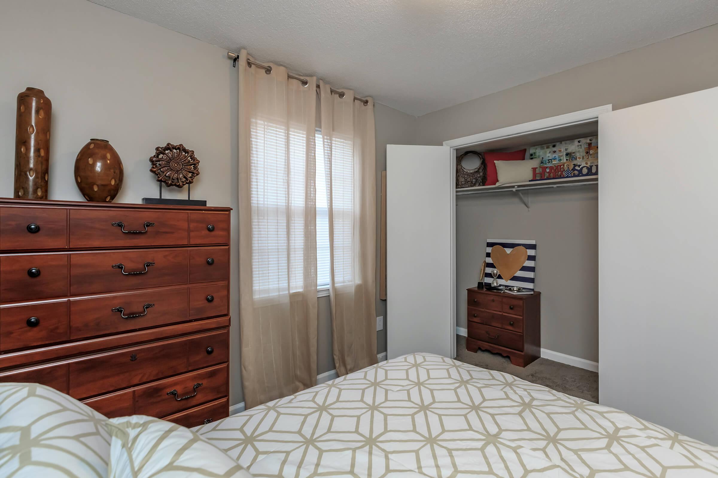 a bedroom with a bed in a room