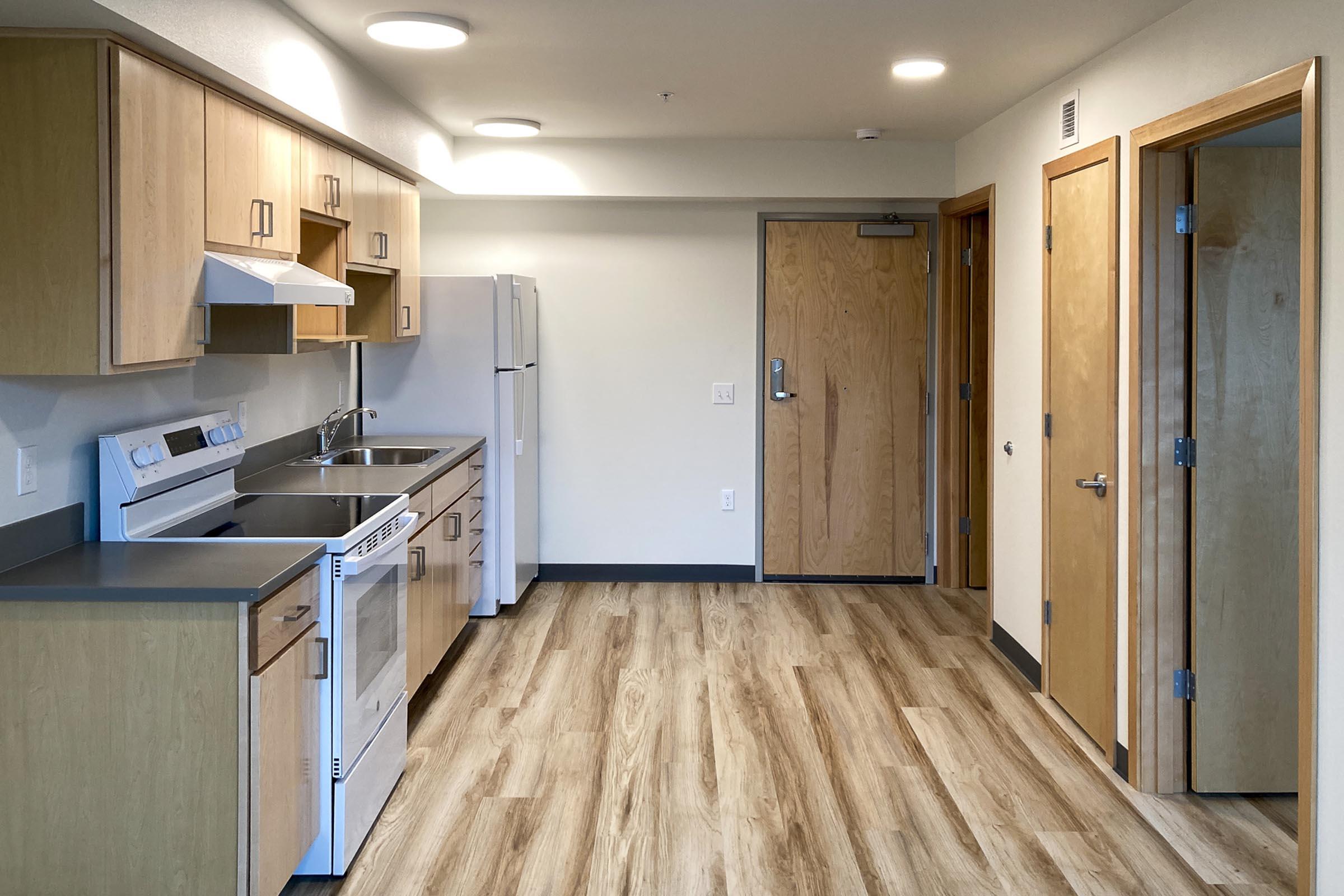 a kitchen with a wood floor