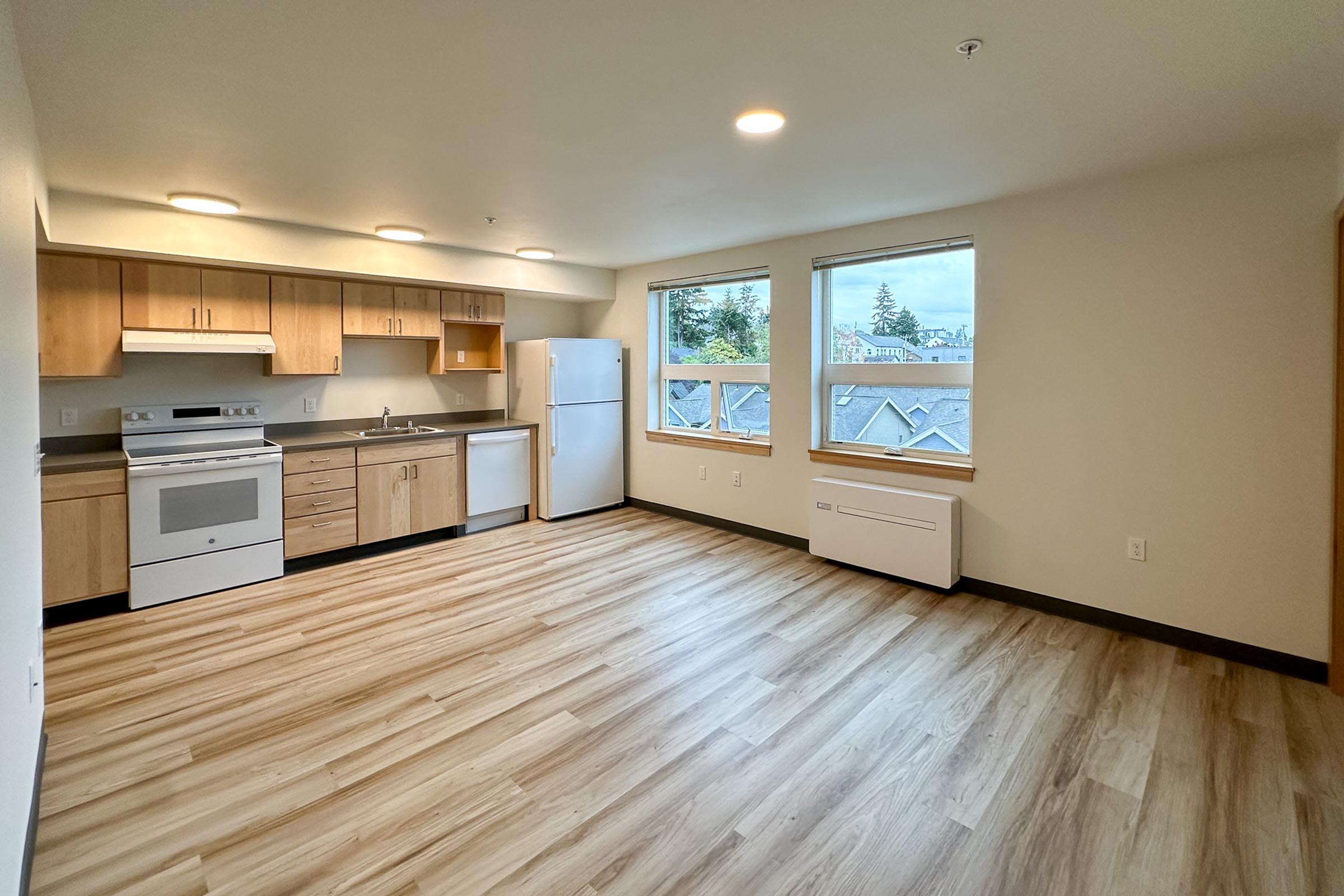 a kitchen with a wood floor