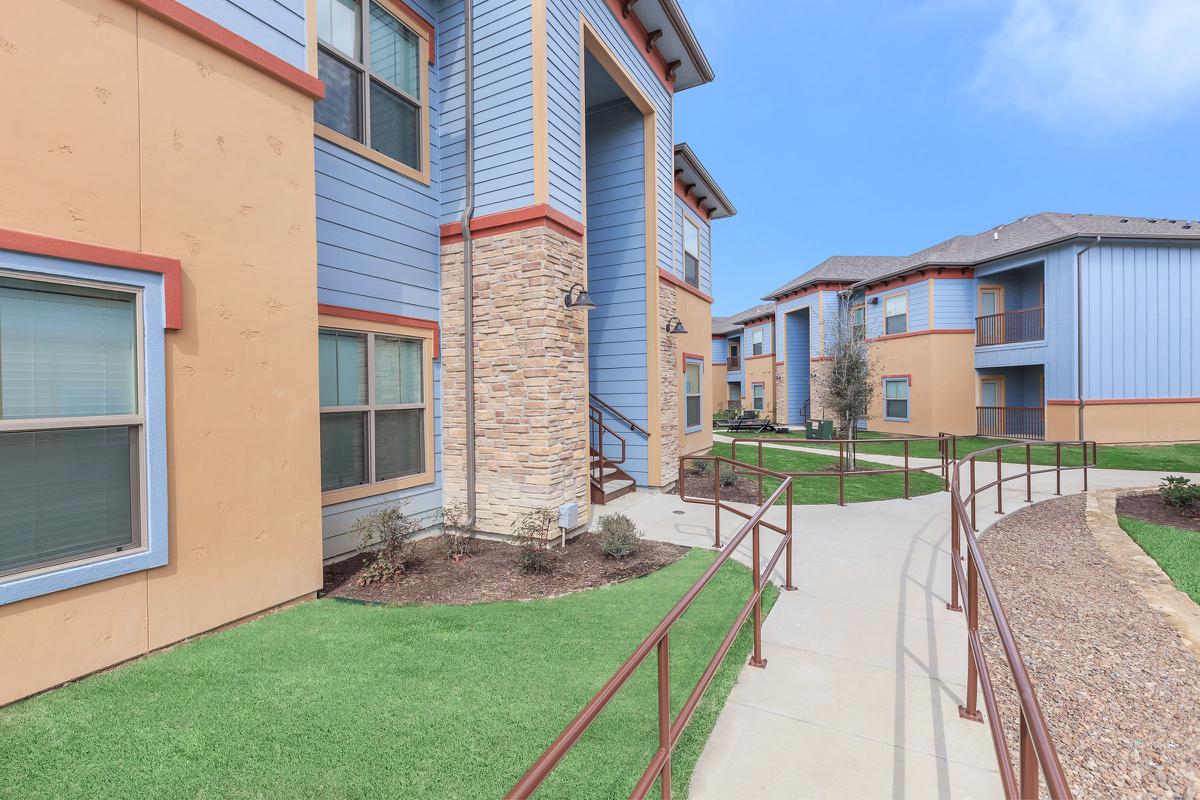 a large lawn in front of a building