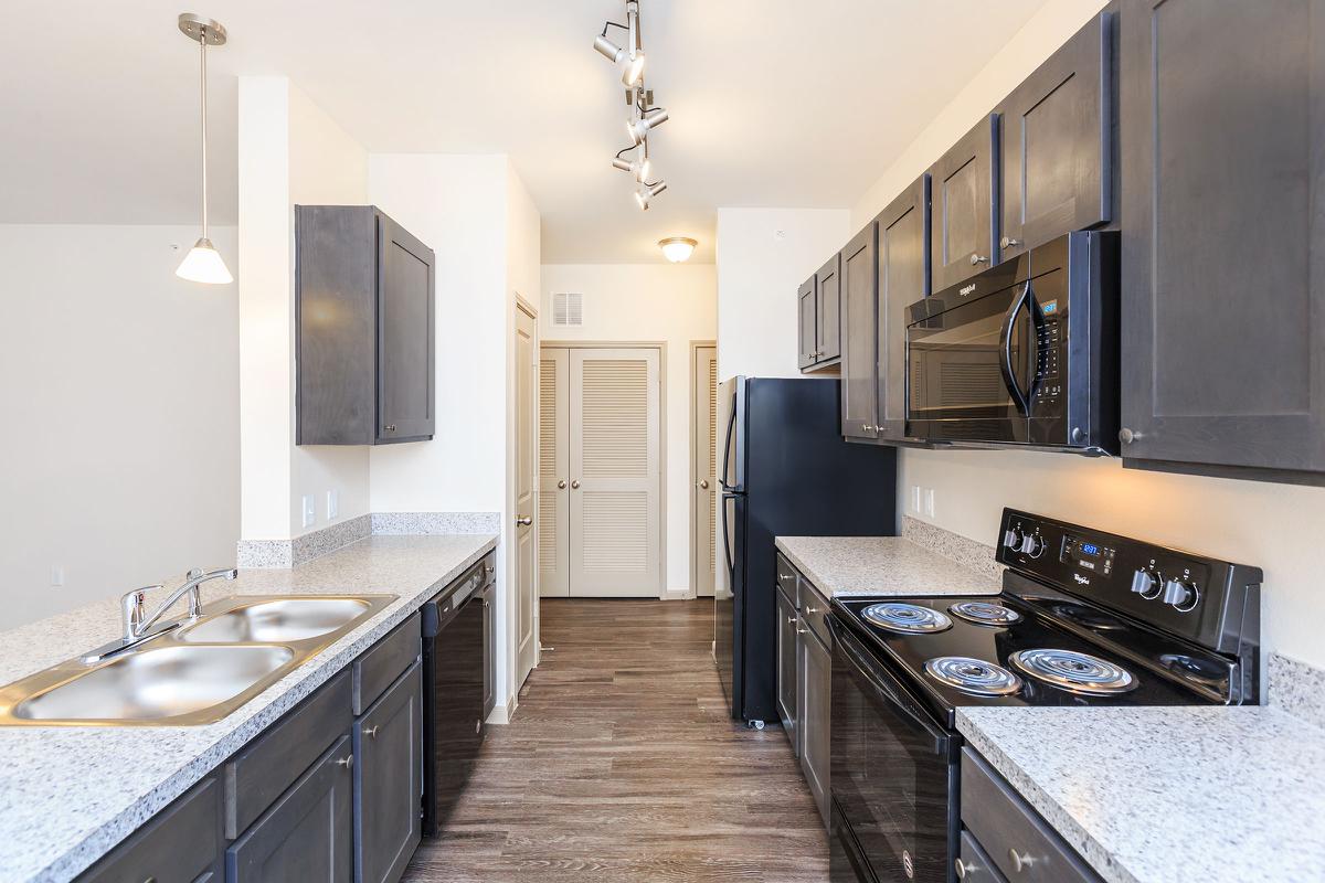 a modern kitchen with stainless steel appliances