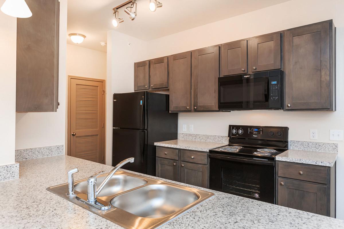 a modern kitchen with stainless steel appliances