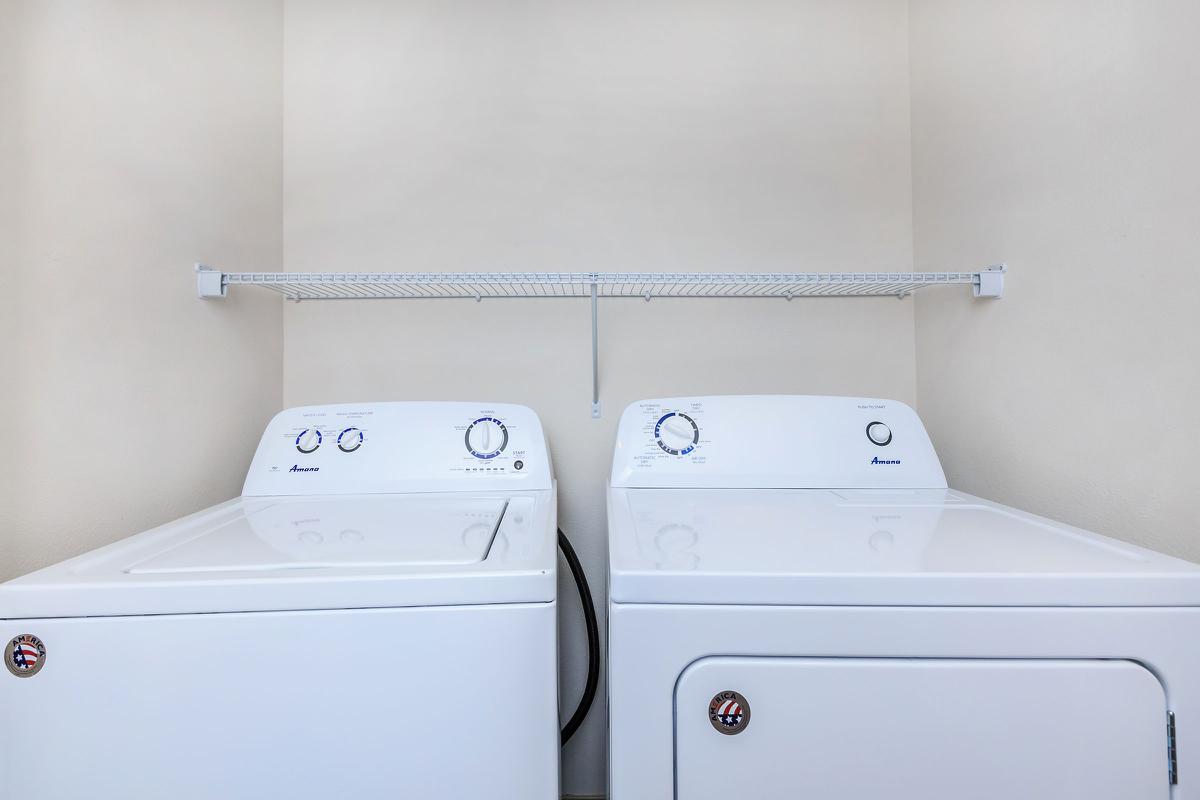 a white refrigerator freezer sitting in a room