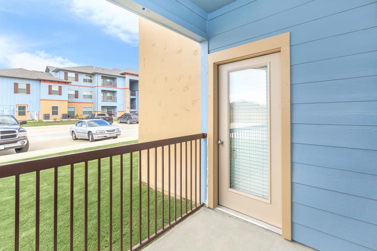 a building with a fence in front of a window