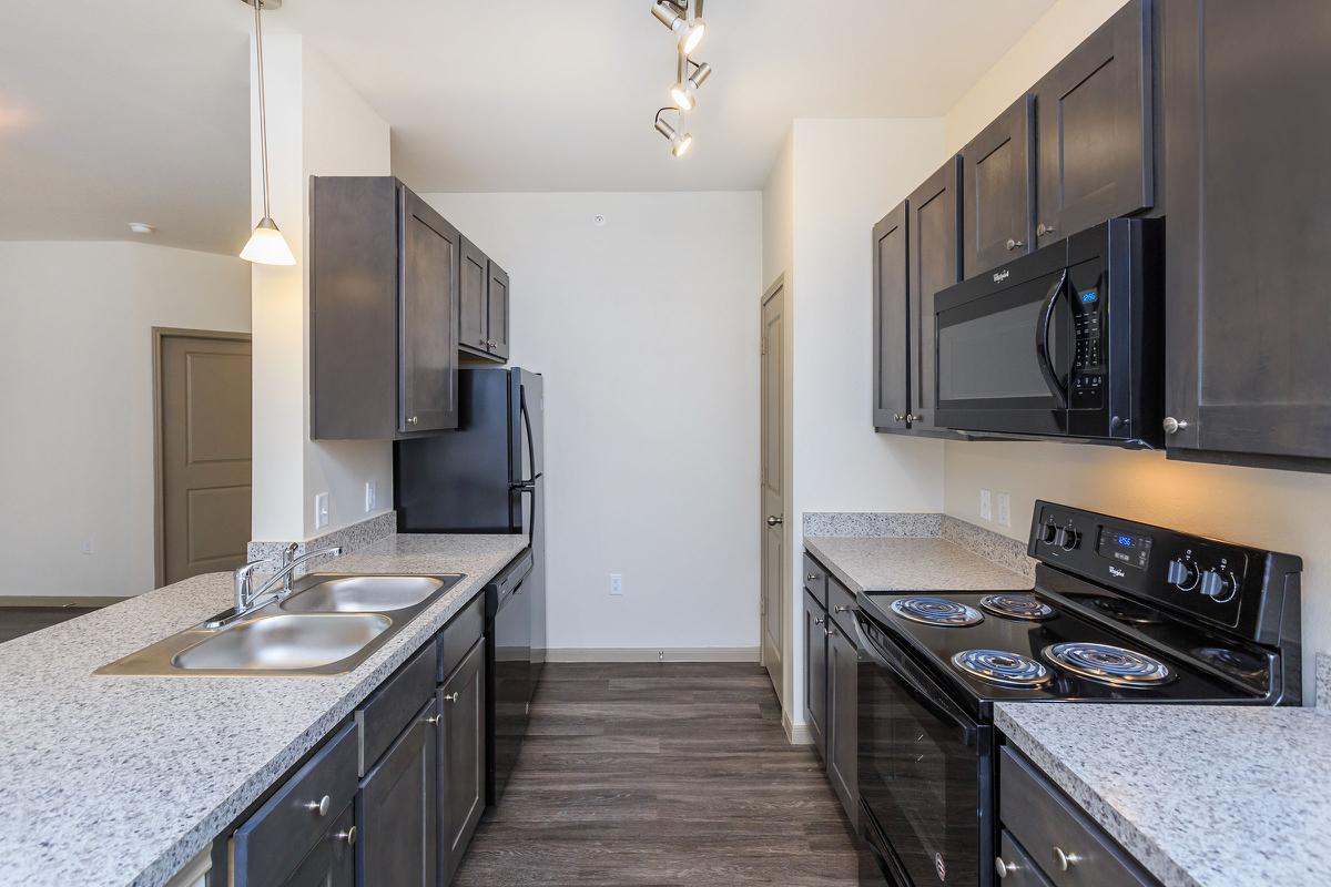 a modern kitchen with stainless steel appliances