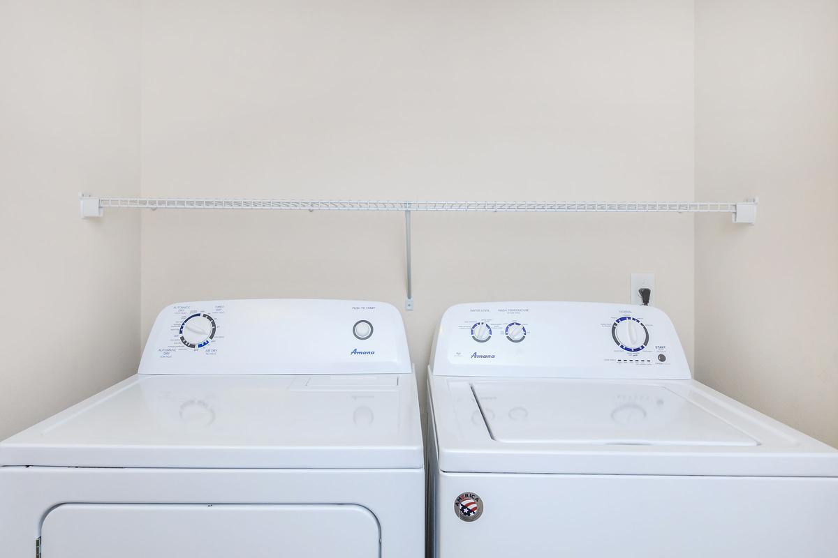 a white refrigerator freezer sitting inside of a kitchen