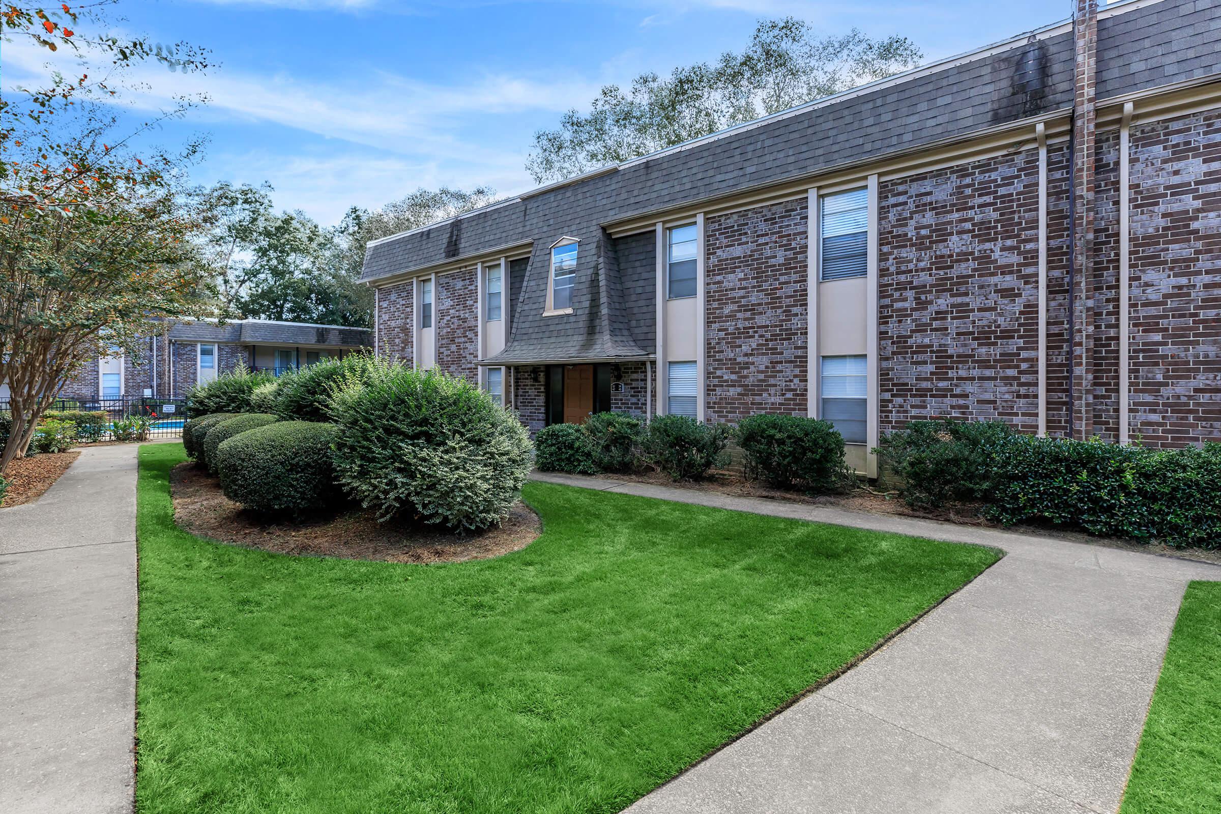 a large lawn in front of a building