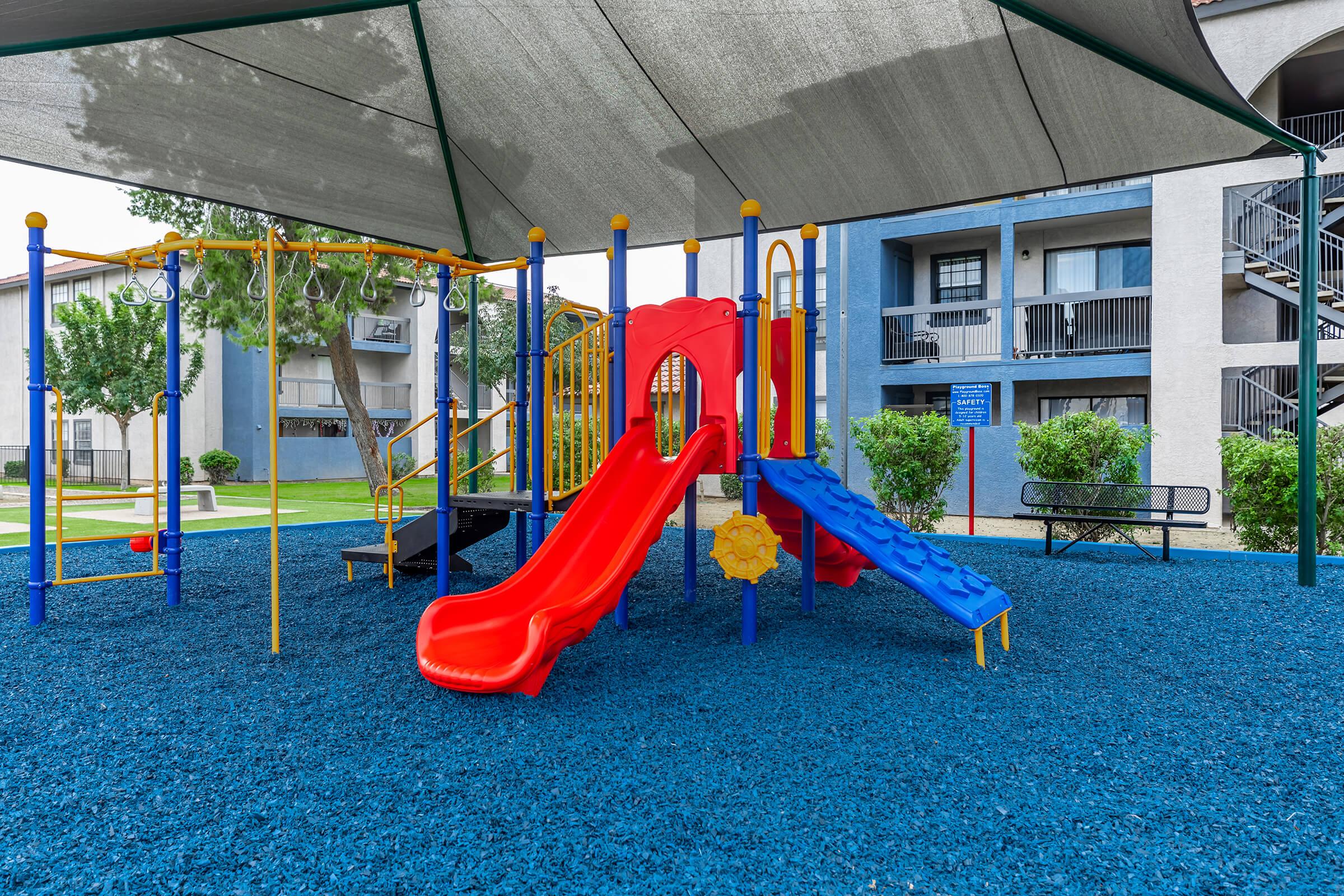 a playground with a blue chair