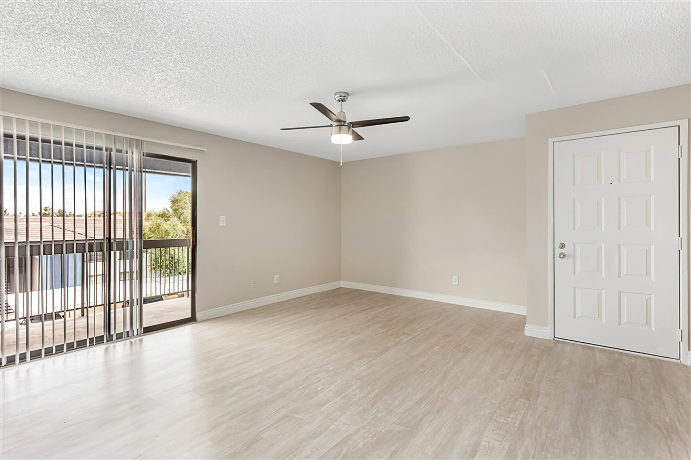 a large empty room with a wood floor