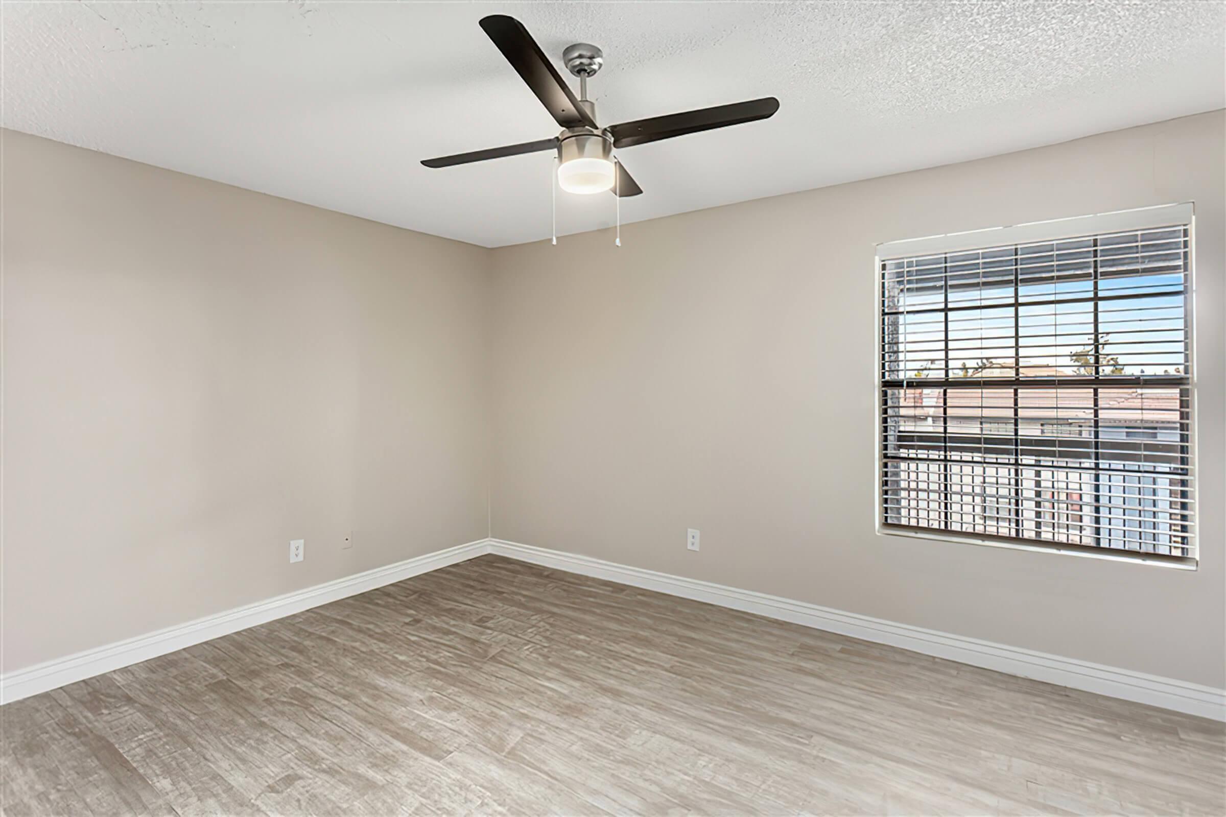 a bedroom with a large window