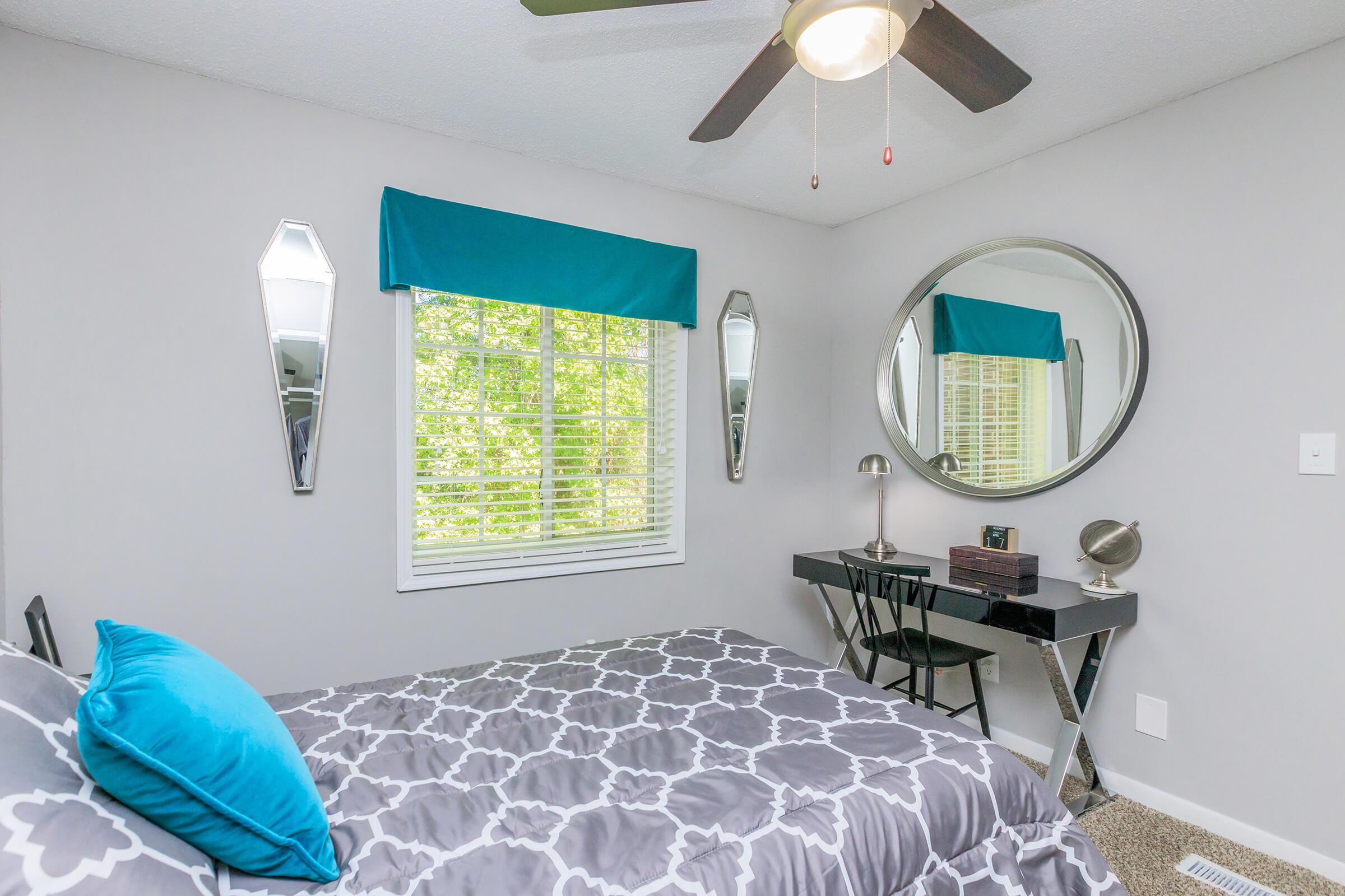 a bedroom with a bed in a room