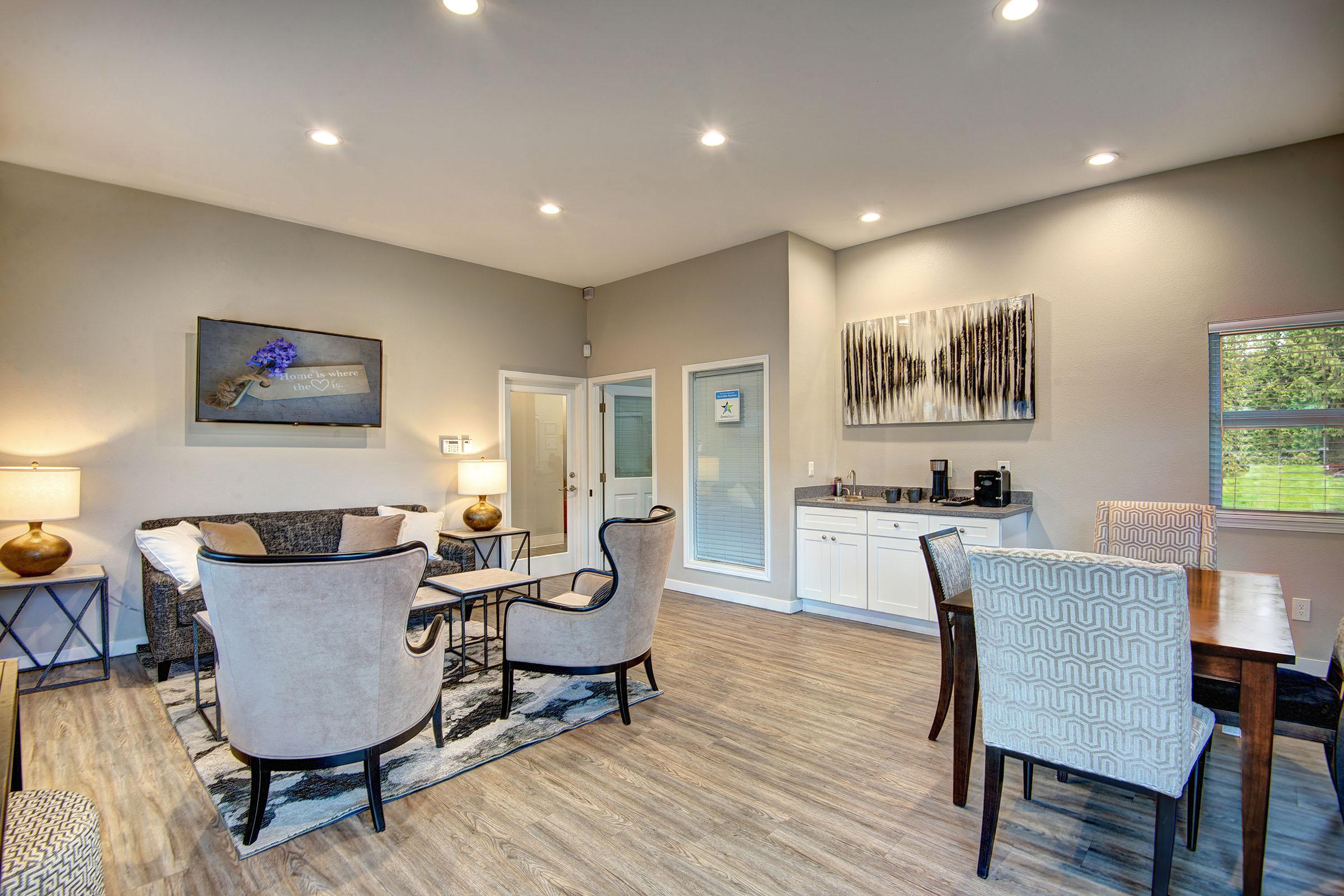 a living room filled with furniture and a table