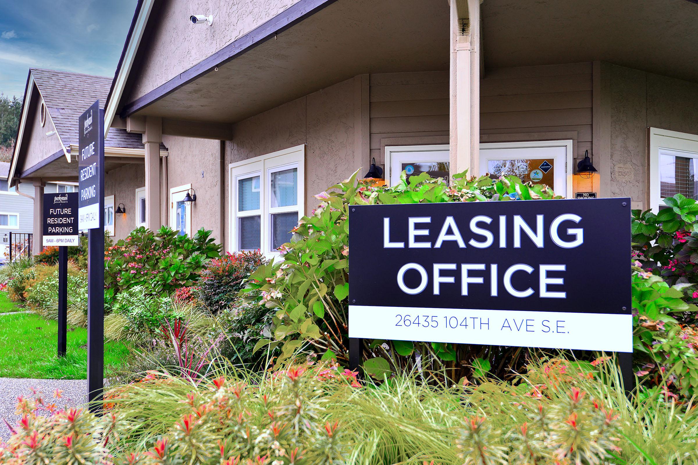 a sign in front of a building