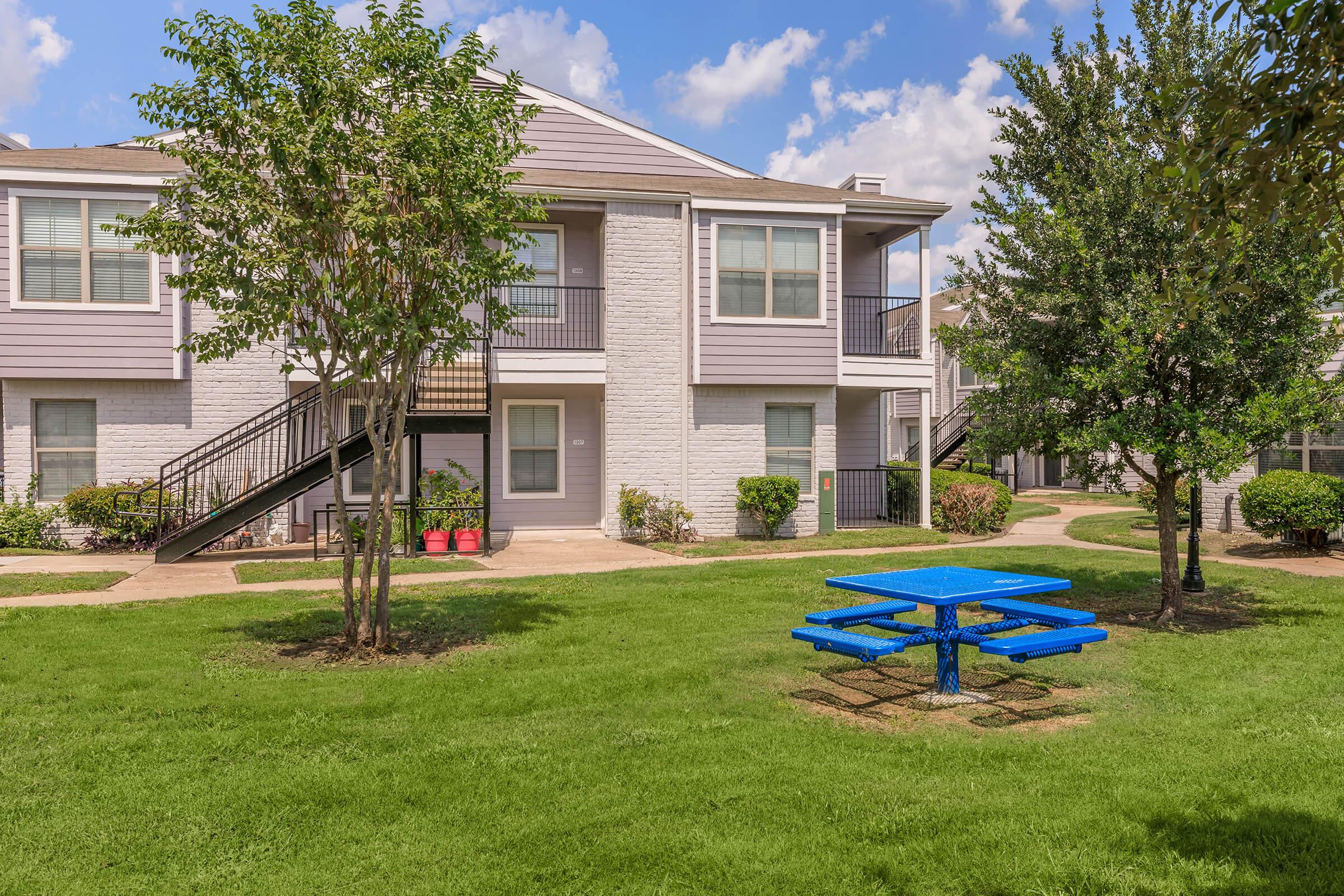 a large lawn in front of a house