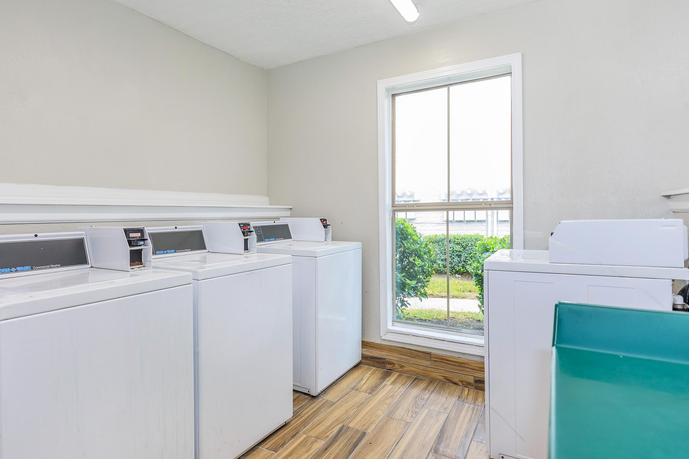 a kitchen with a sink and a refrigerator