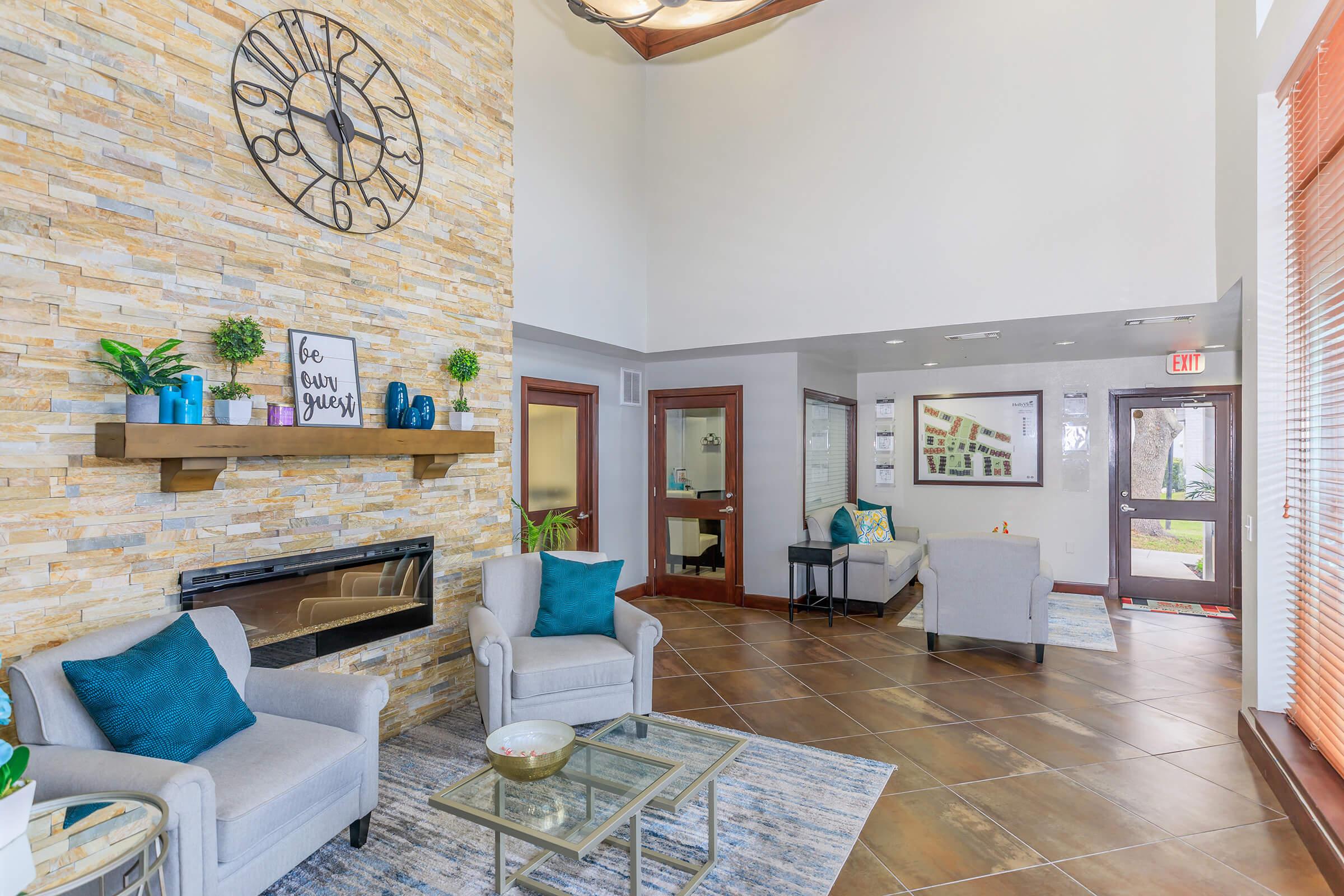 a living room filled with furniture and a fireplace