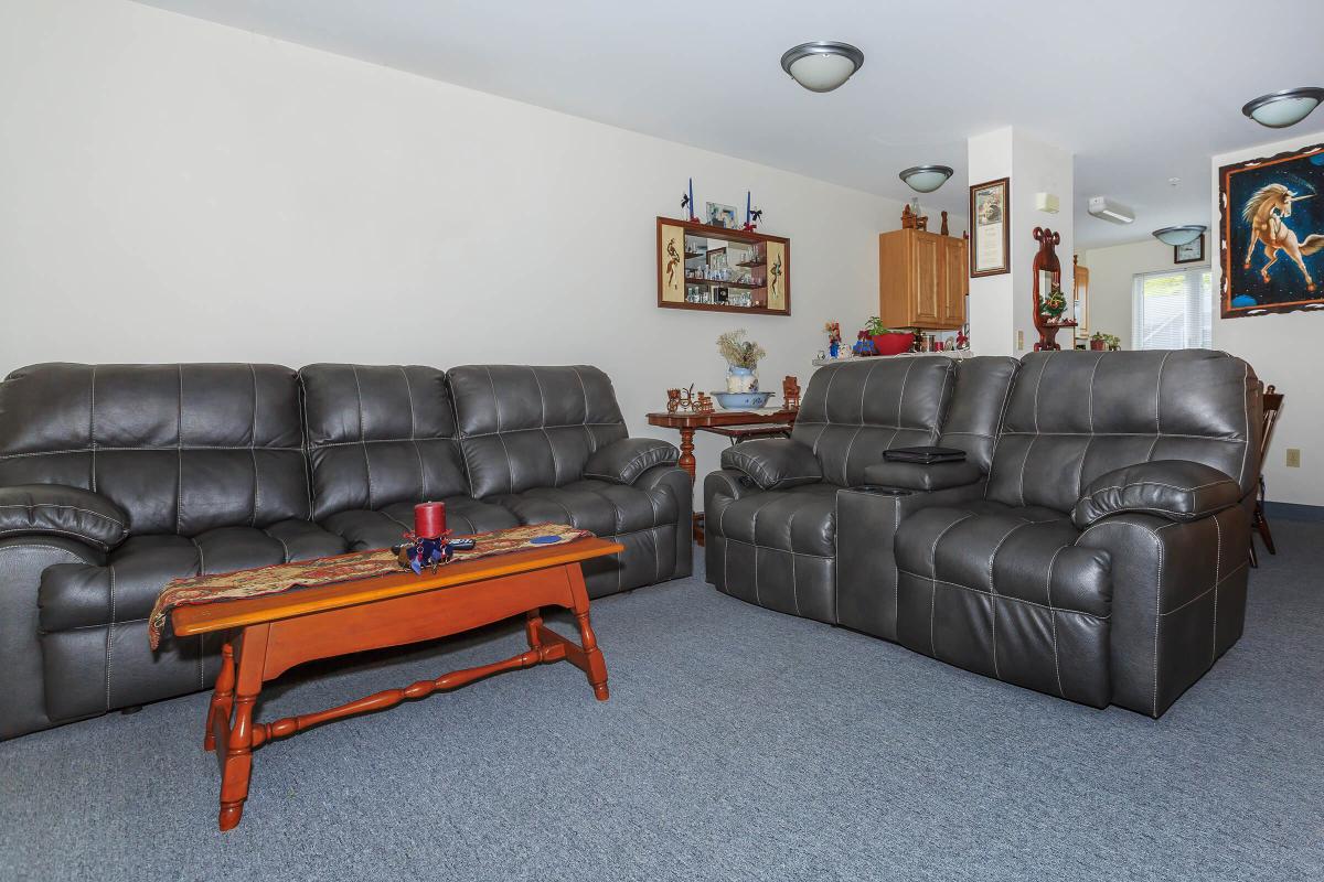 a brown leather couch in a living room