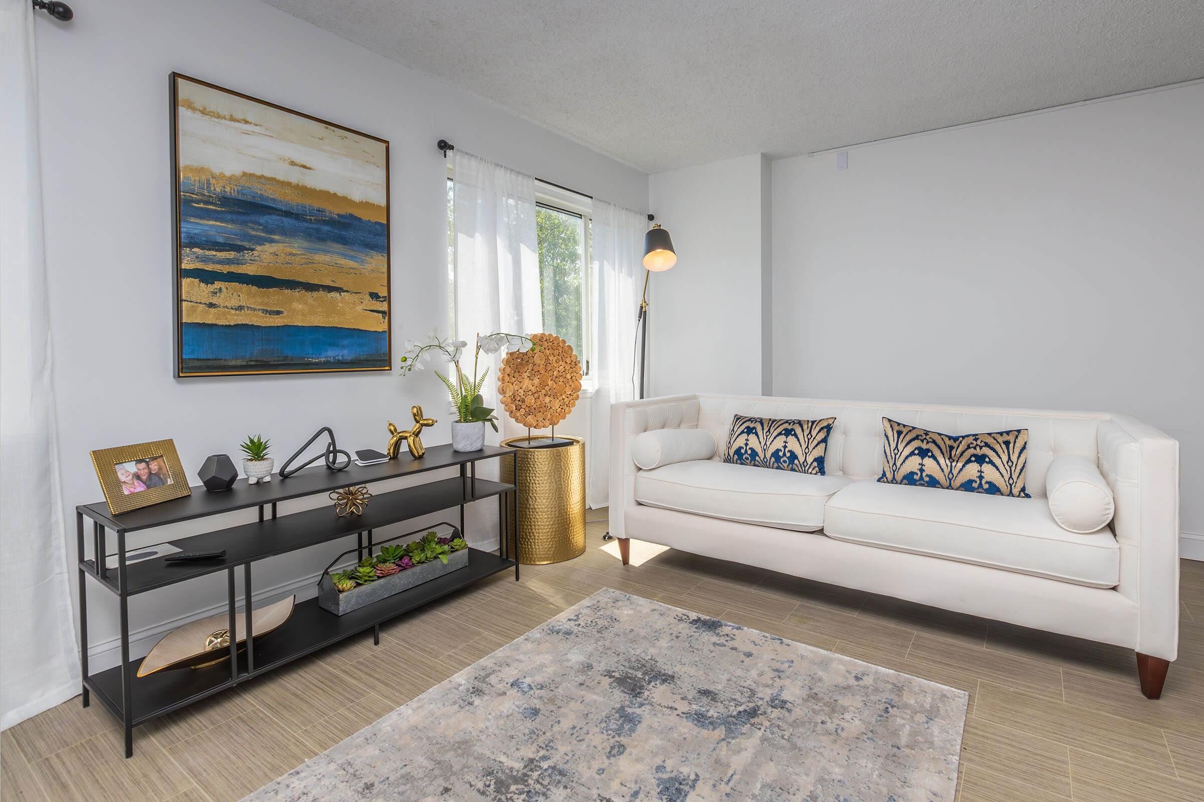 a living room filled with furniture and a rug