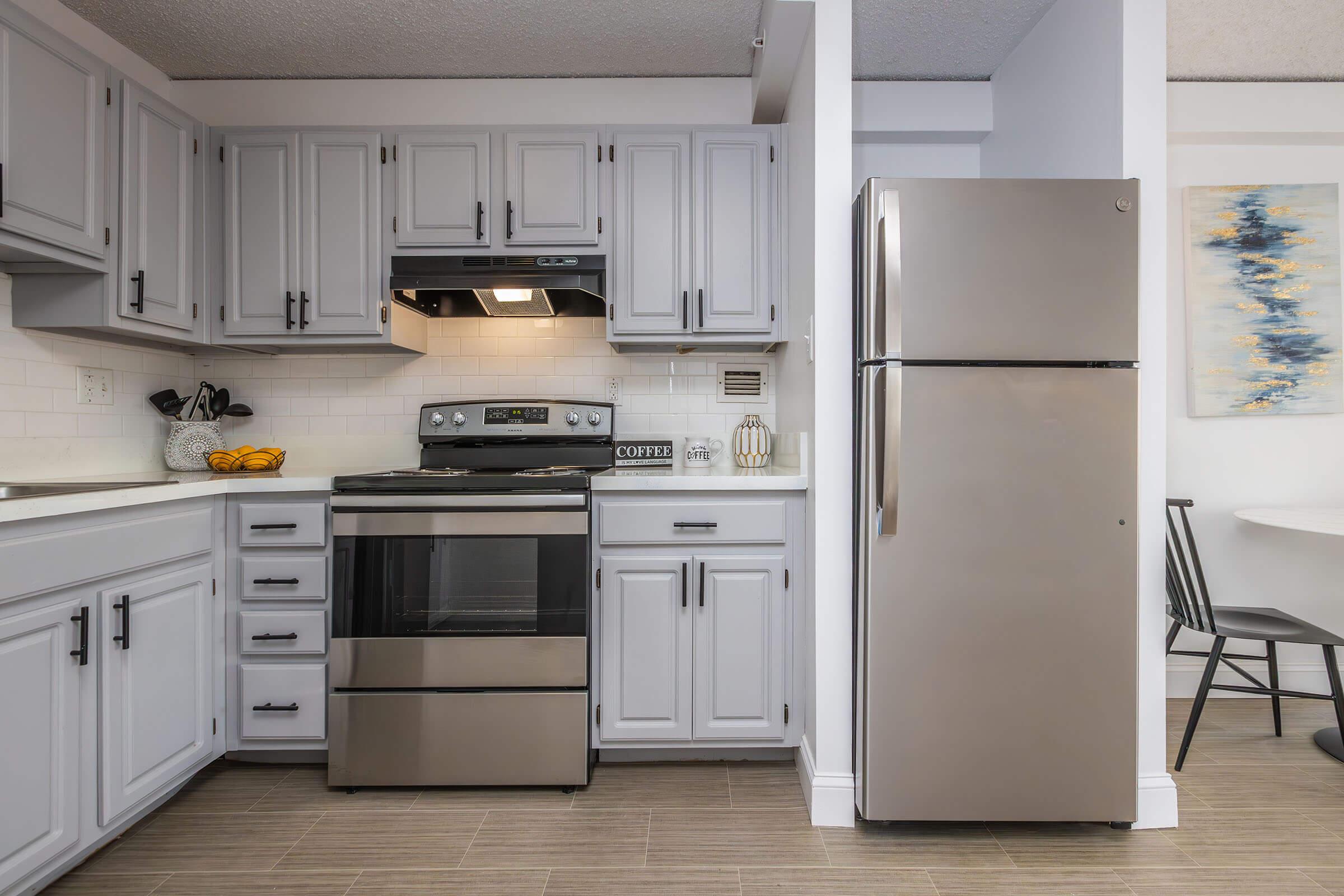 a kitchen with a stove top oven sitting inside of a refrigerator