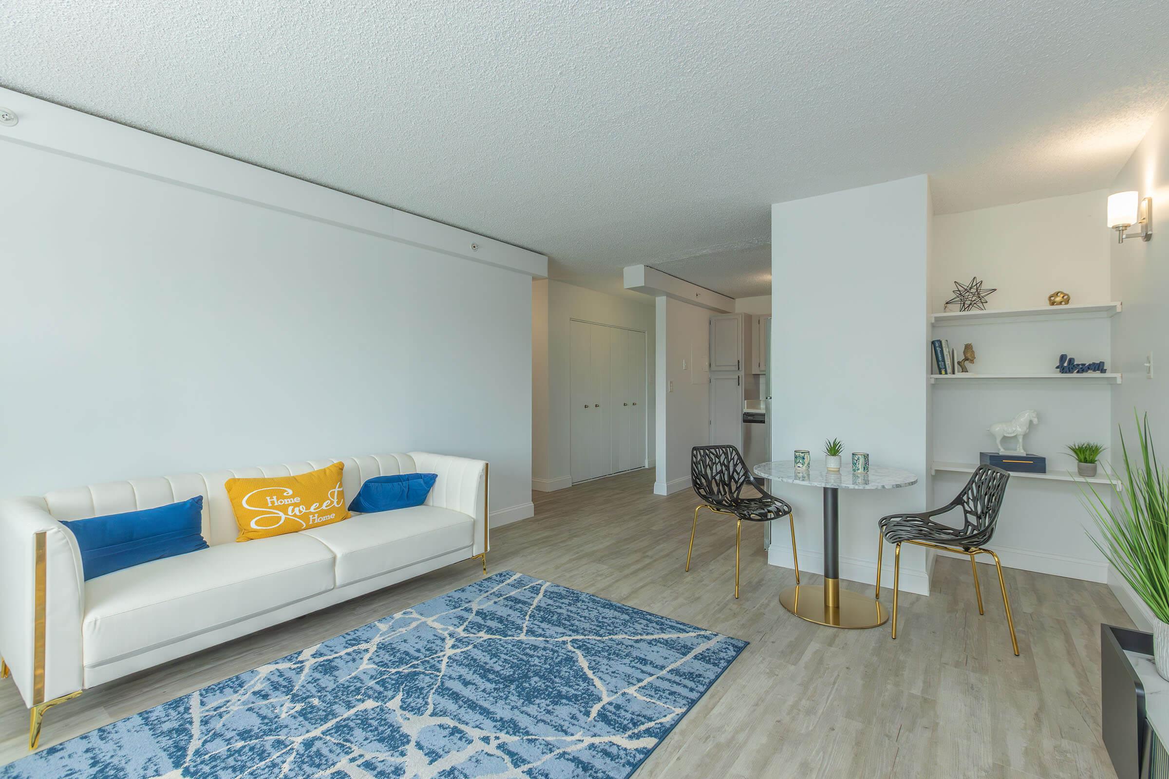 a living room filled with furniture and a table