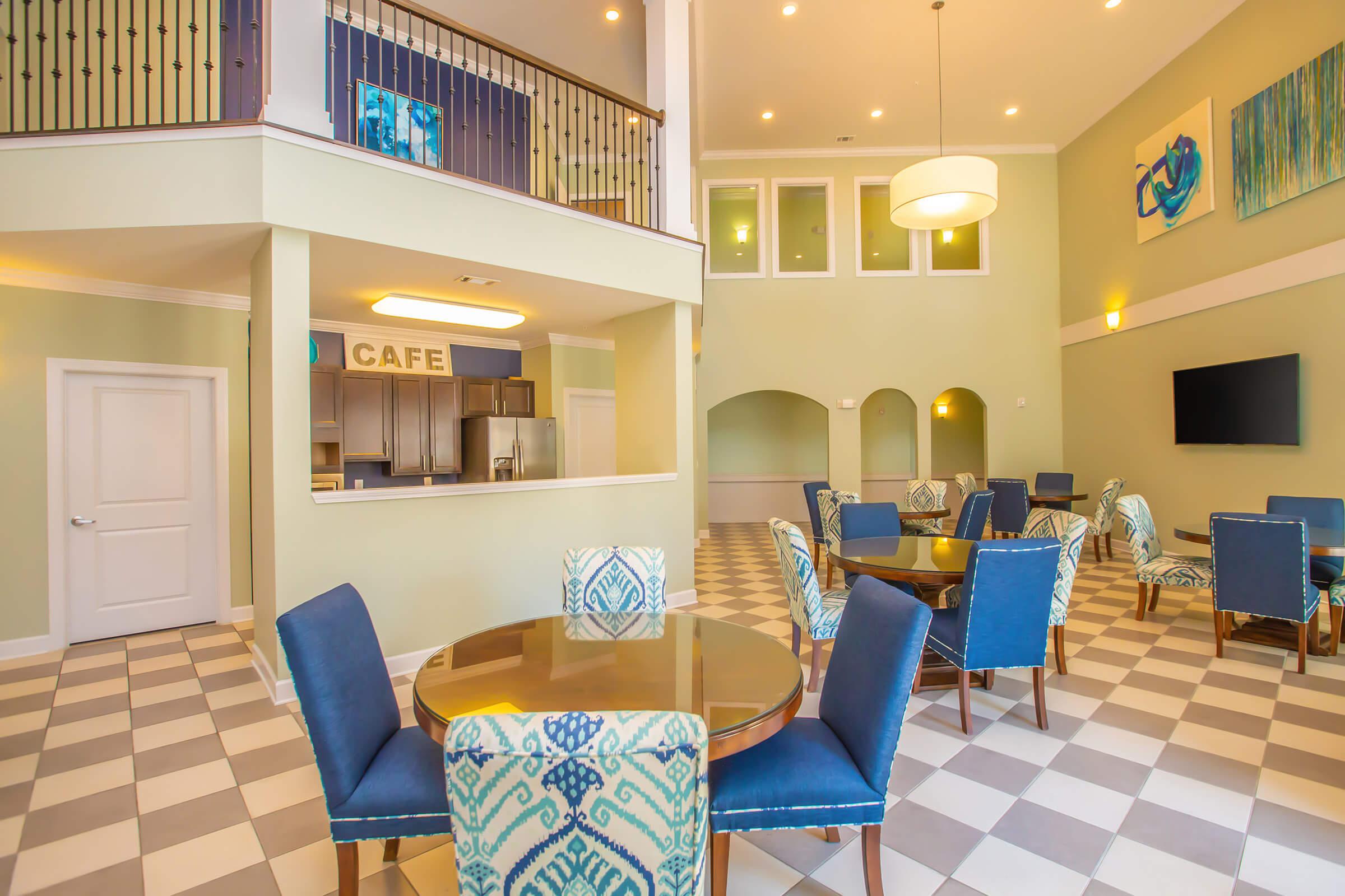 a living room filled with furniture and a table