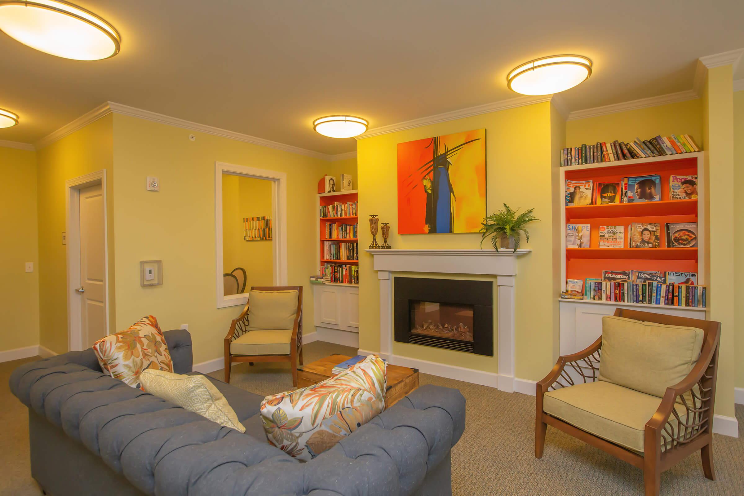 a living room filled with furniture and a flat screen tv